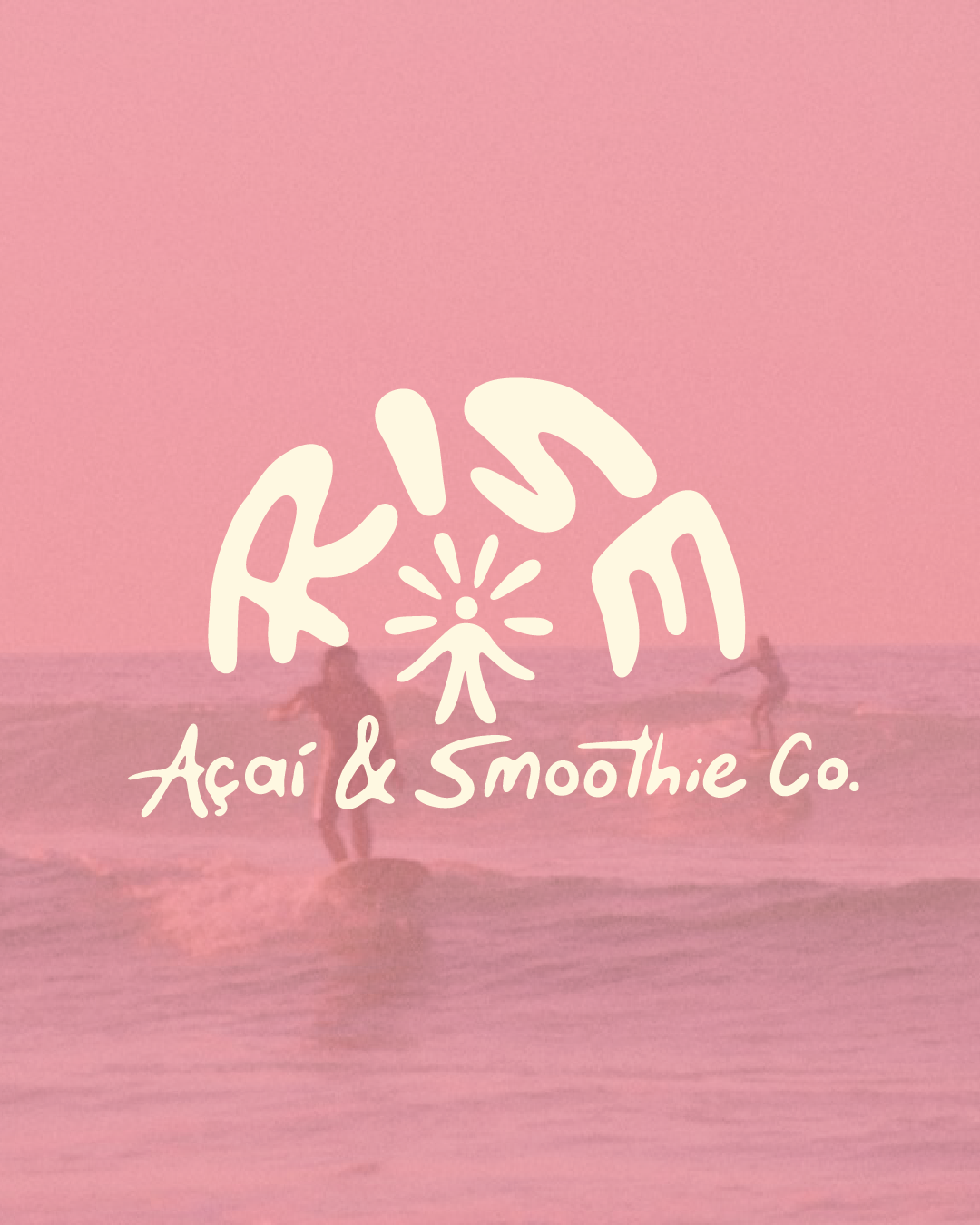 Pink-tinted beach scene with two people surfing, overlayed with white text reading 'Kisn Açaí & Smoothie Co.' and a stylized flower logo.