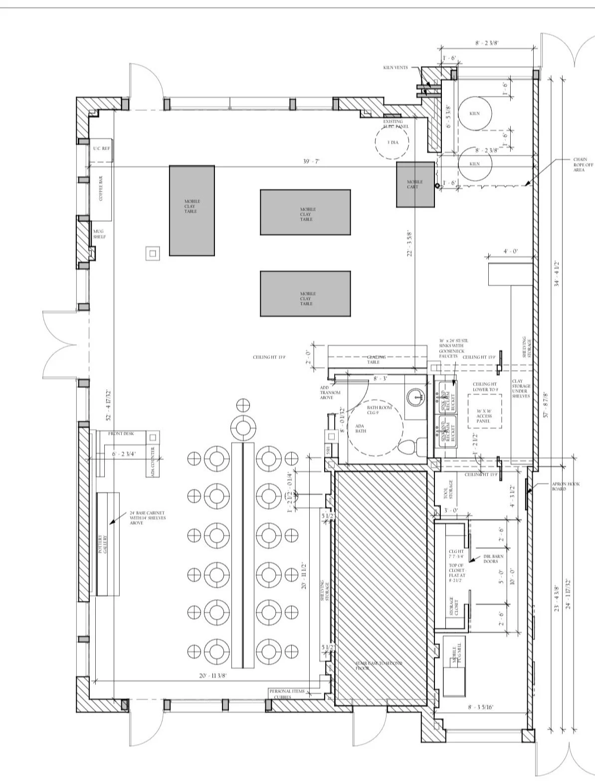 Floor plan of a building with labeled rooms, furniture, and measurements.