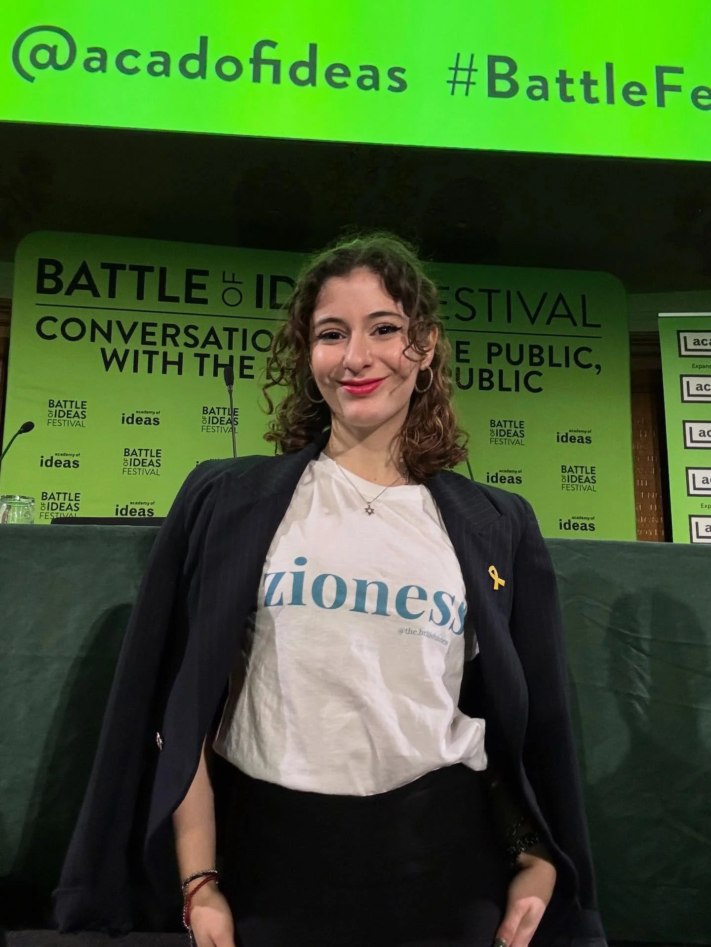 Debuting my new T-shirt, now available for pre-order on my website, link in bio 🔗 
Standing tall and proud at the Battle of Ideas. 
Loud and proud Zioness. Always.