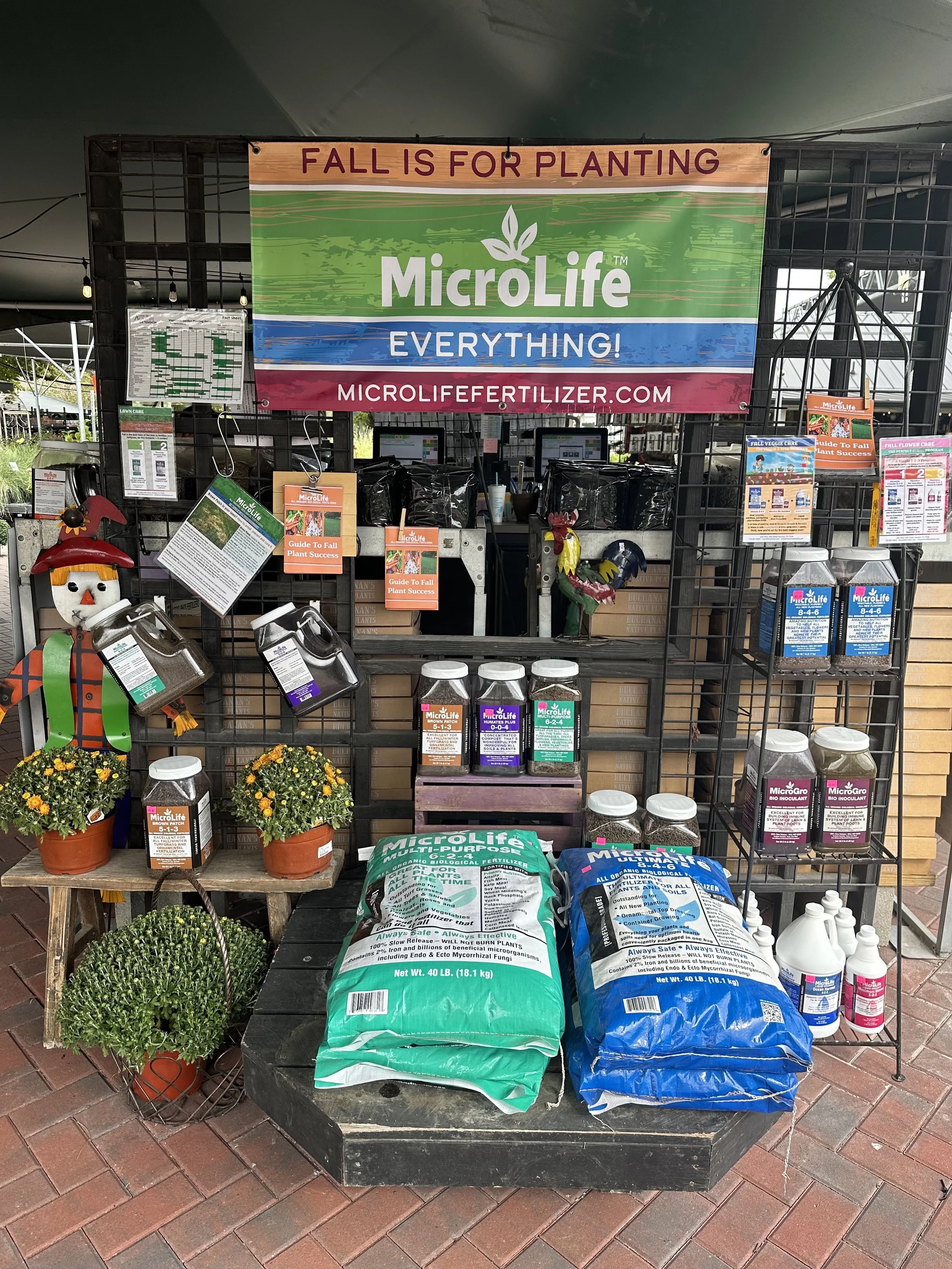 Seasonal fall fertilizer display demonstrating visual merchandising techniques that inspire customer action.
