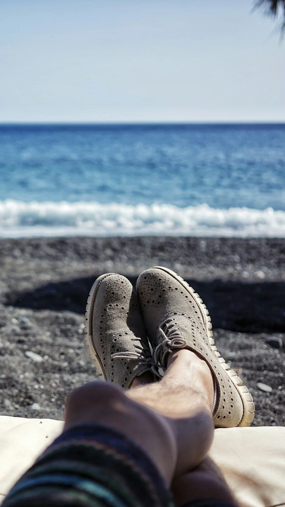 Feet‑up beach view symbolizing profits earned by renting idle points through Owner Rental.