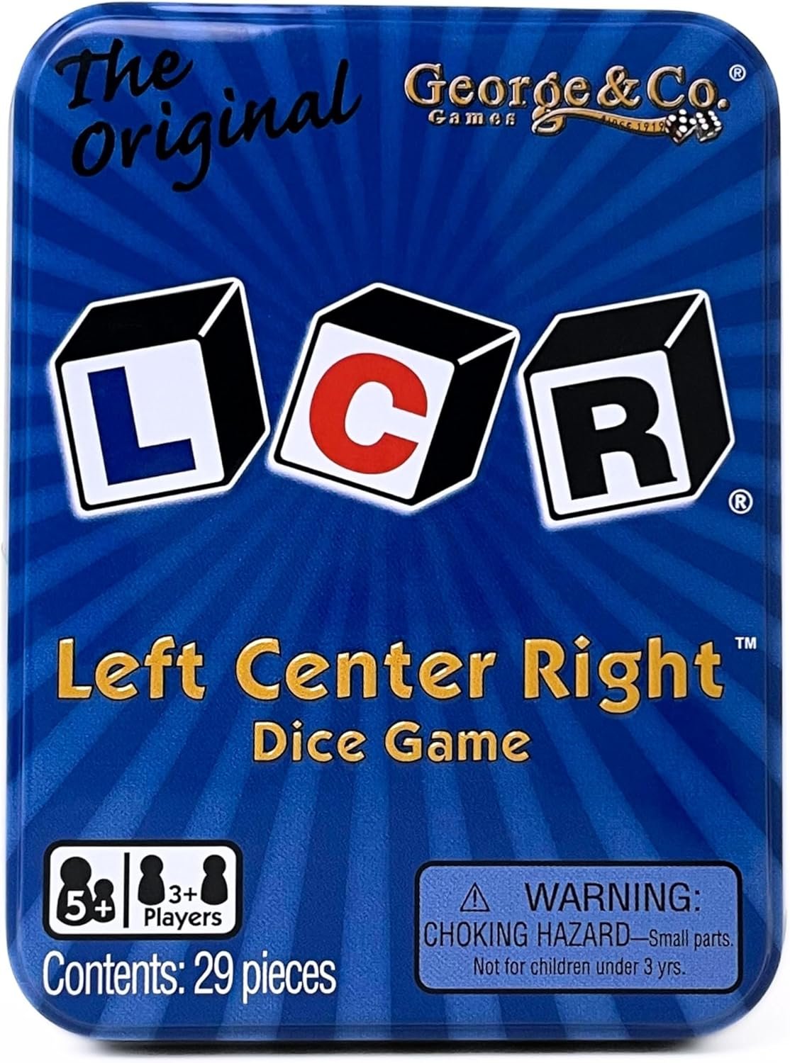Blue box of the game 'Left Center Right' with three black and white die showing L, C, R. Contains 29 pieces, for ages 5 and up, suitable for 3 or more players.