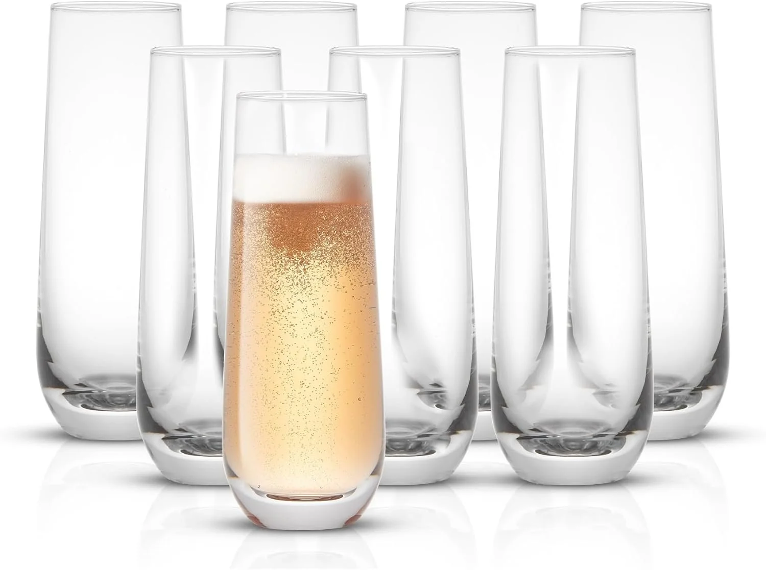 A group of seven empty champagne flutes with one filled with sparkling wine, placed on a white surface with a white background.