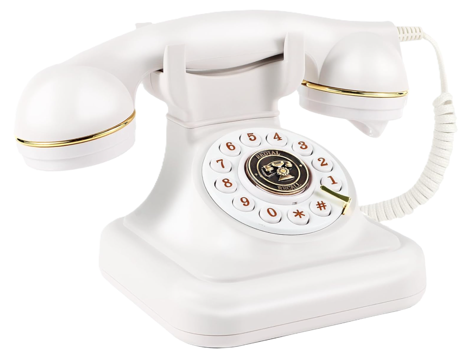 A vintage white rotary telephone with gold accents.