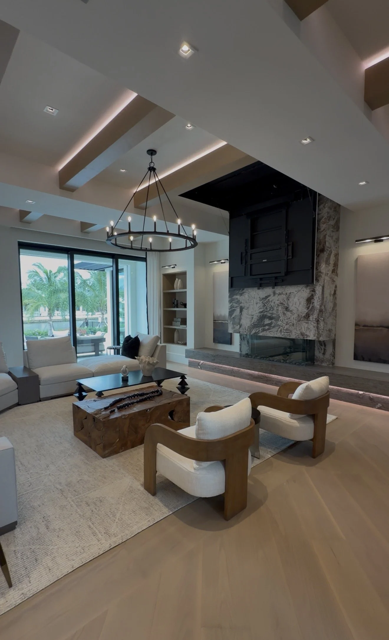  Retractable television lowered from the ceiling above the stone fireplace in the 1340 Spyglass great room. 
