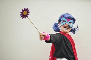 Girl with blue hair wearing a mask