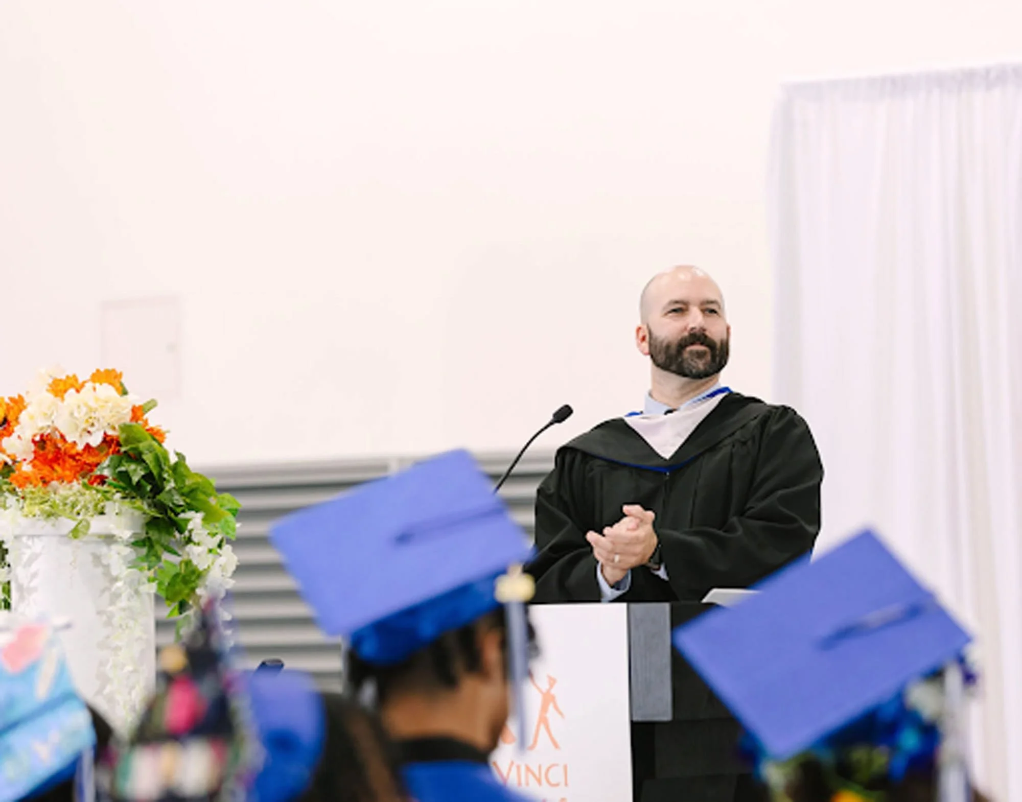Russell Stoll, an experienced school principal, at graduation for Da Vinci Schools