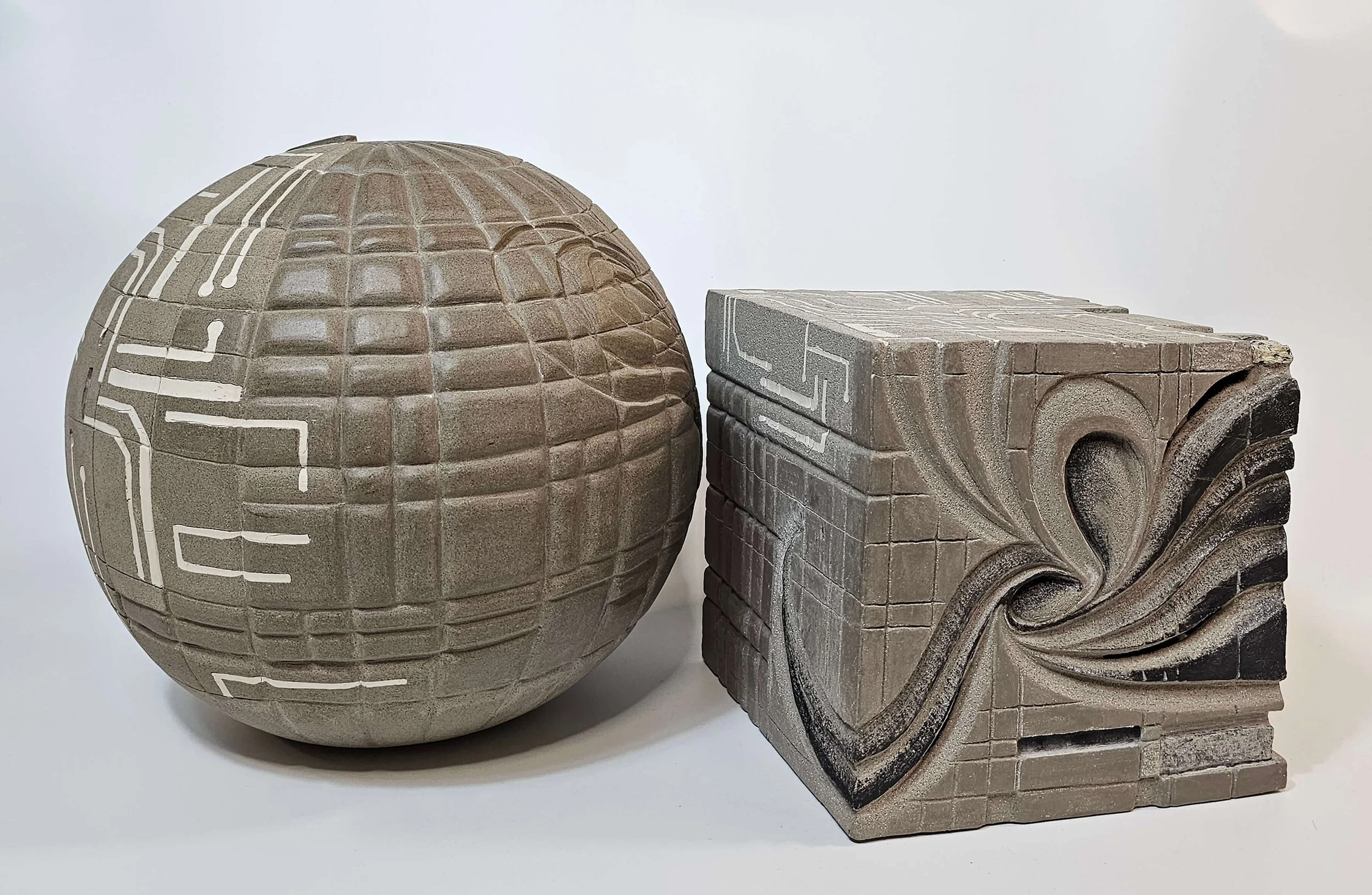 Hand-built ceramic sculpture in porcelain and stoneware questioning creativity, ownership, and artistic expression.