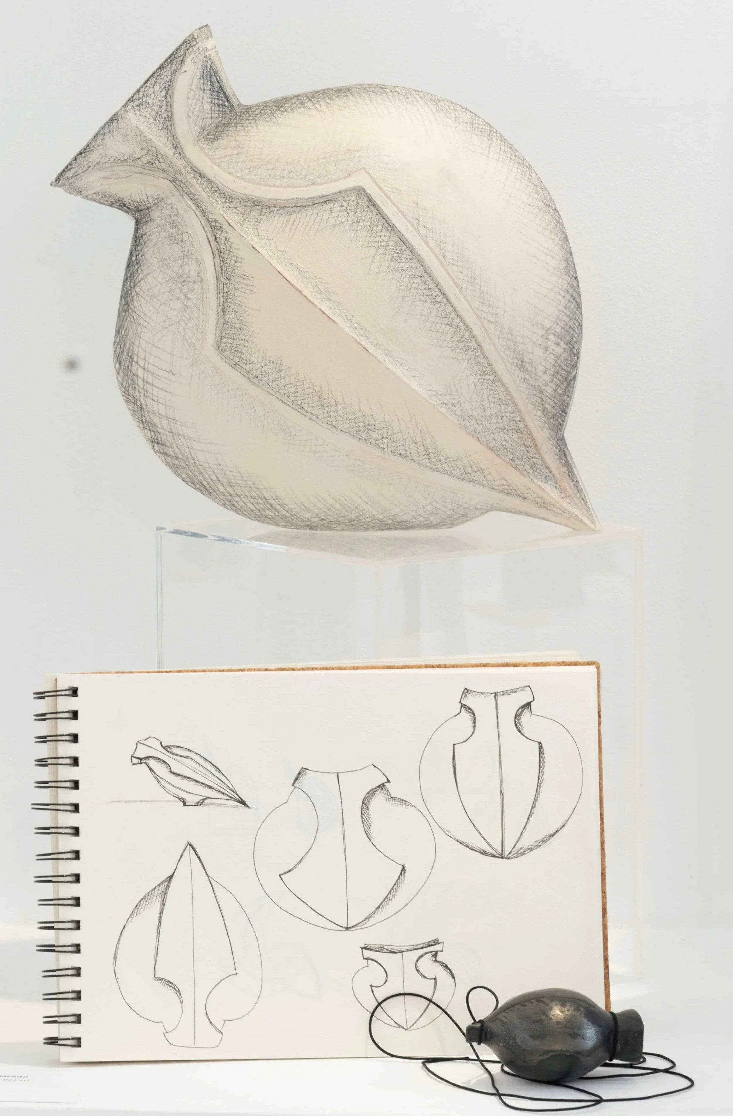 Detail of Perpetual Current ceramic sculpture showing the sketches