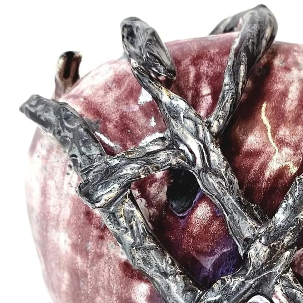 Mirsini Roumelioti. Mirsini Ceramics. Uncaged. Hugs.  Red ceramic sculpure wrapped with dark, twisted metal like ceramic wires.