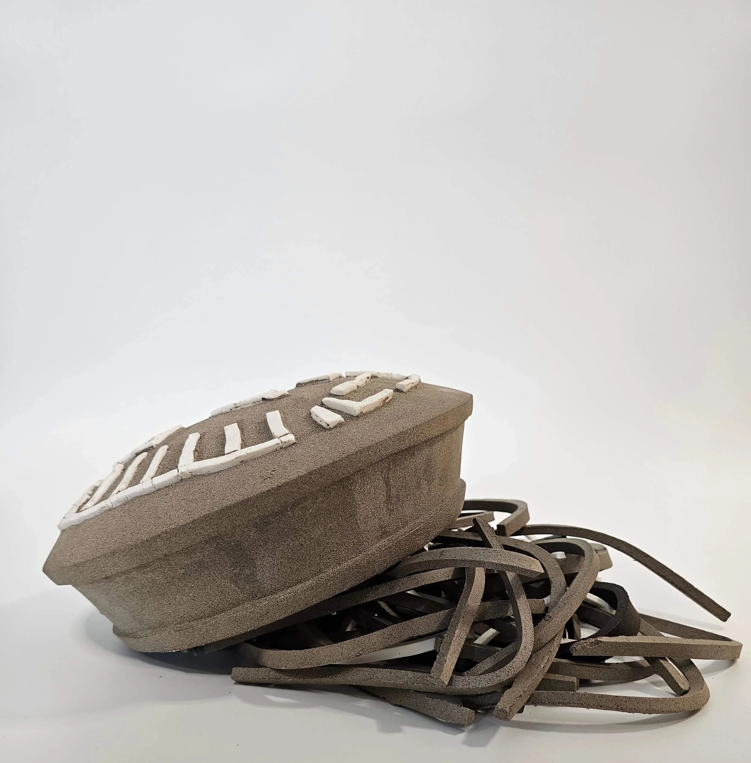 Ceramic sculptural form with carved surface and porcelain elements inspired by Dimitris Pikionis
