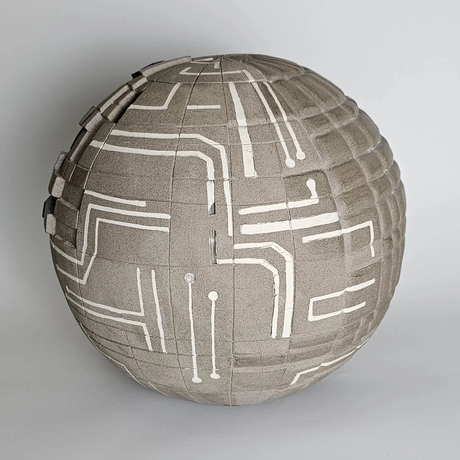 Conceptual ceramic artwork composed of handcrafted forms inviting reflection on creativity and meaning.