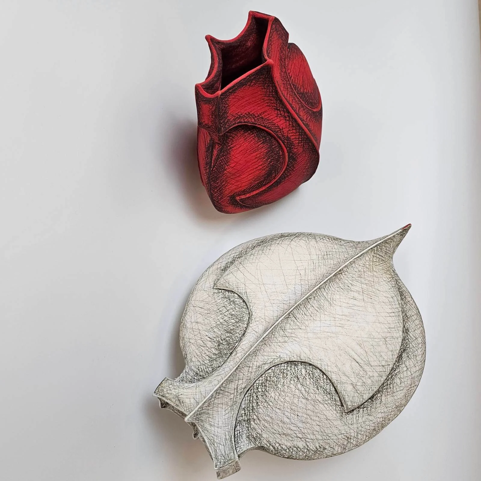 Vital Exchange contemporary ceramic installation with two shield-like stoneware vessels