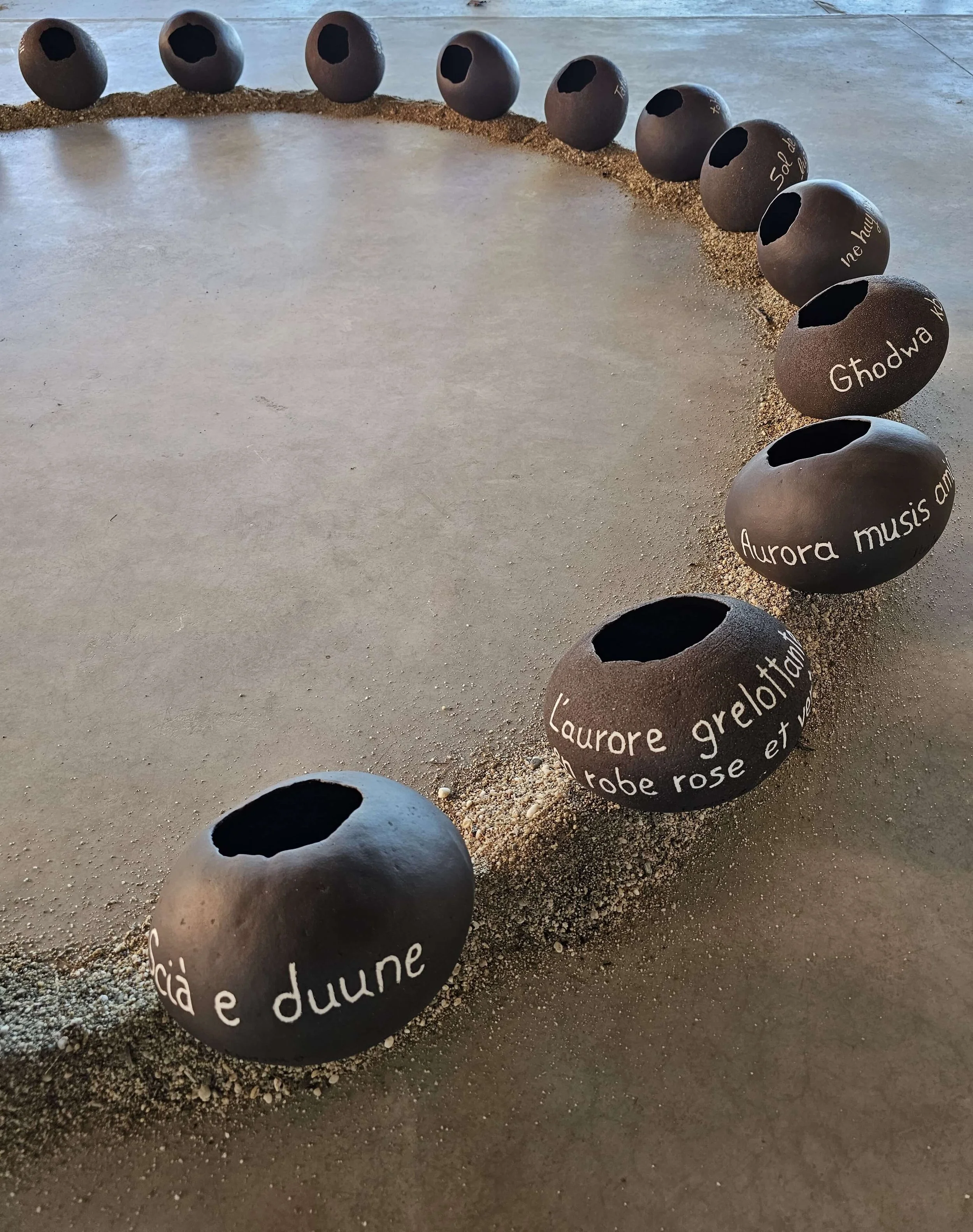 Circular ceramic installation inspired by Mediterranean nations and collective memory