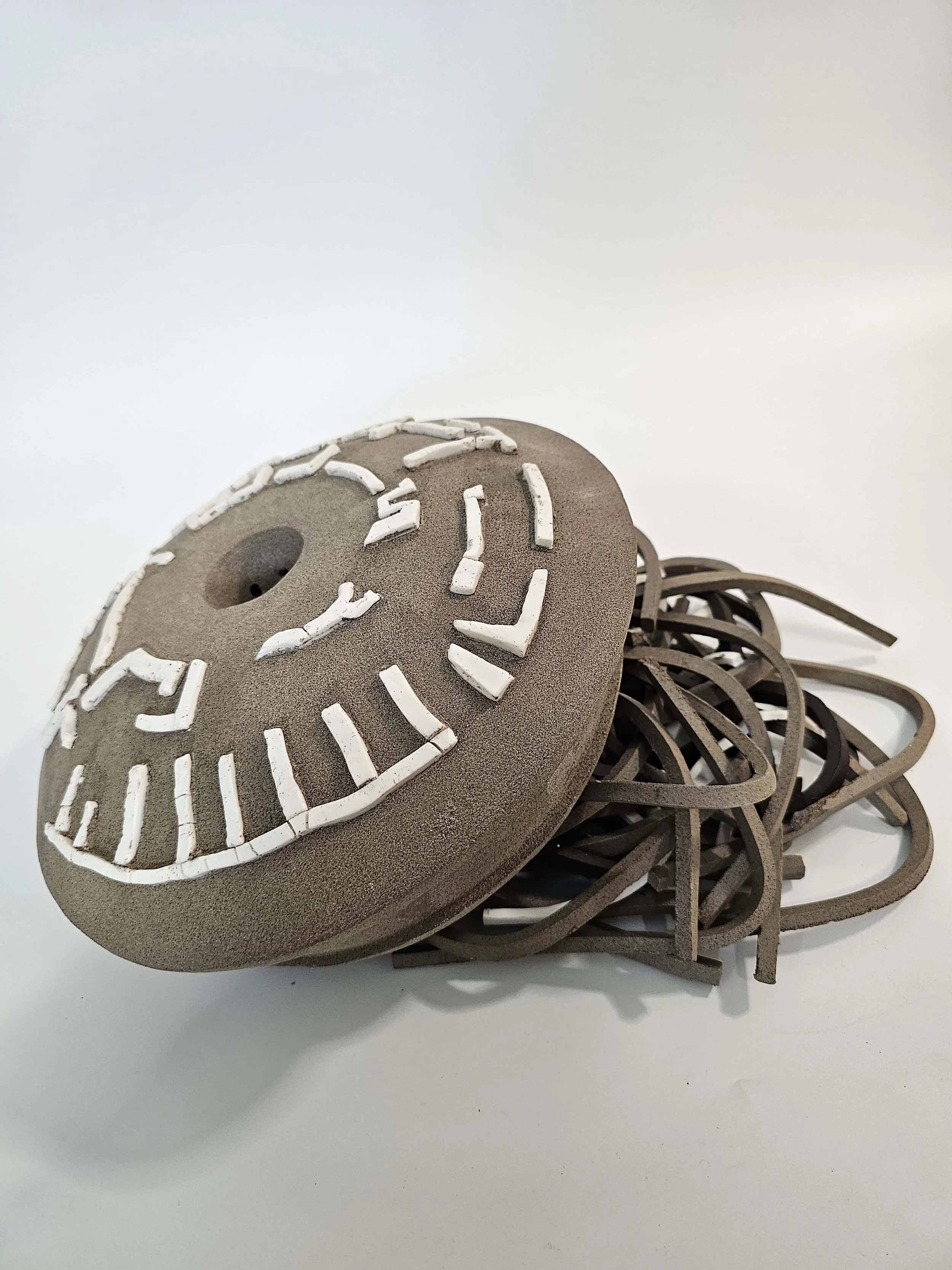 Ceramic sculptural form with carved surface and porcelain elements inspired by Dimitris Pikionis