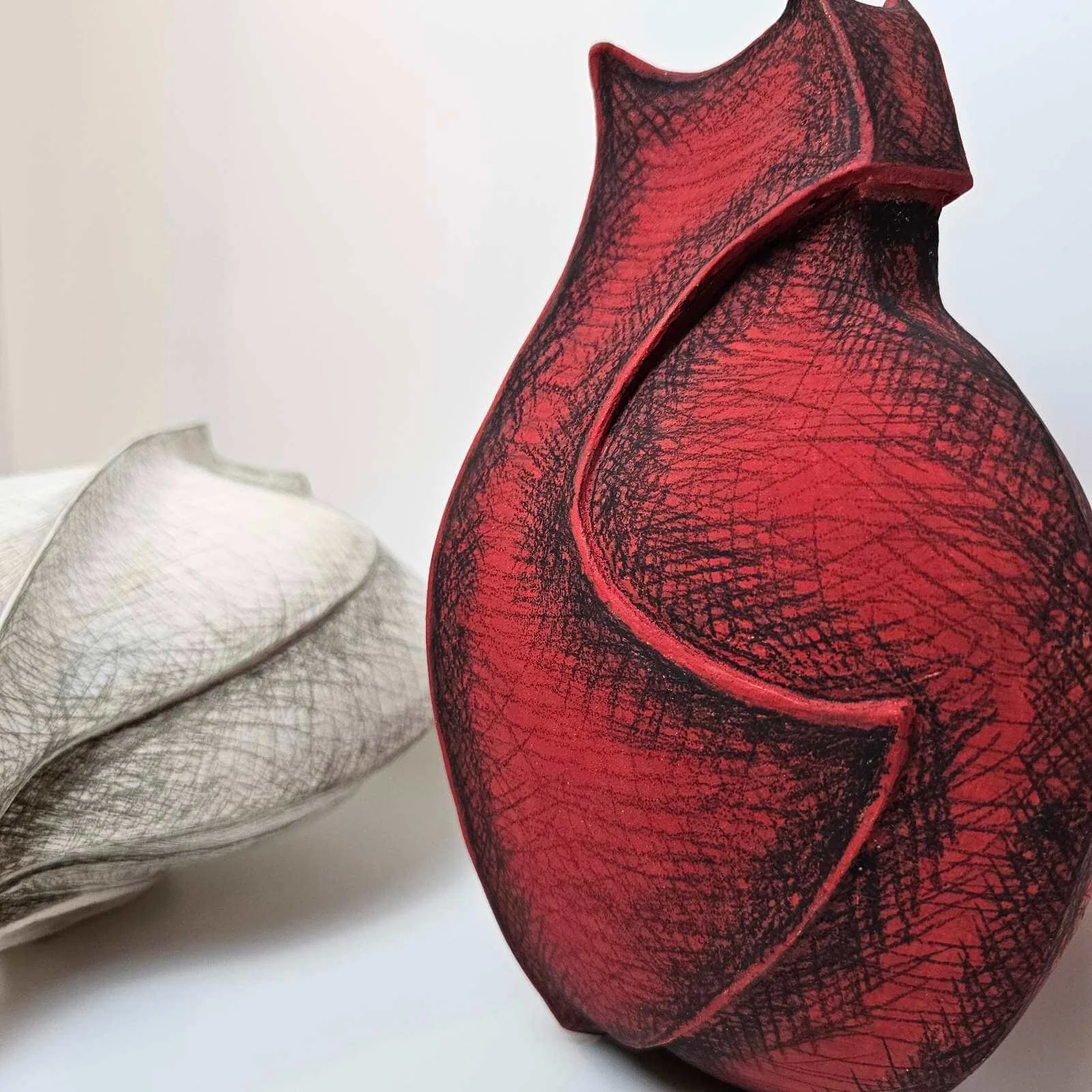 Vital Exchange contemporary ceramic installation with two shield-like stoneware vessels