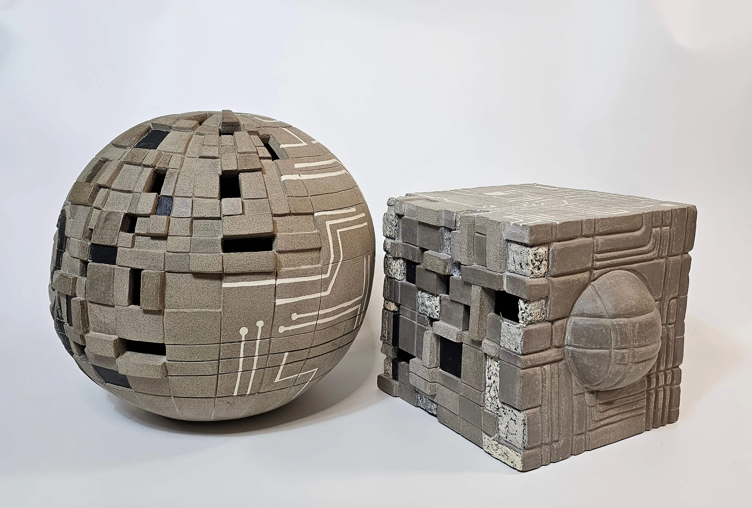 Hand-built ceramic sculpture in porcelain and stoneware questioning creativity, ownership, and artistic expression.