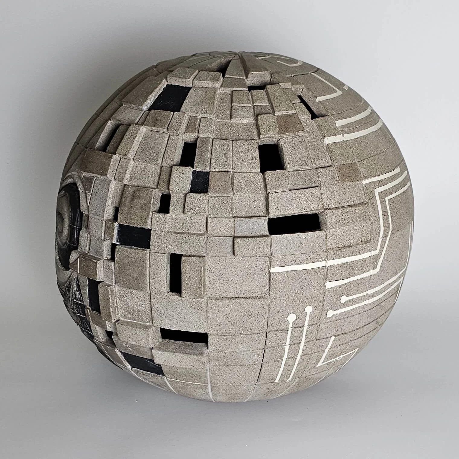 Conceptual ceramic artwork composed of handcrafted forms inviting reflection on creativity and meaning.
