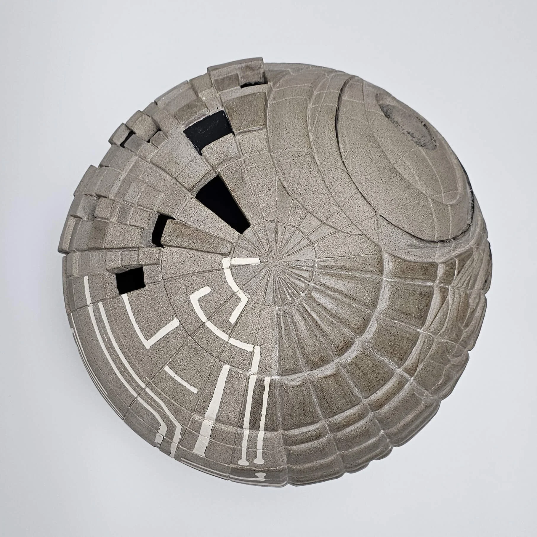 Conceptual ceramic artwork composed of handcrafted forms inviting reflection on creativity and meaning.