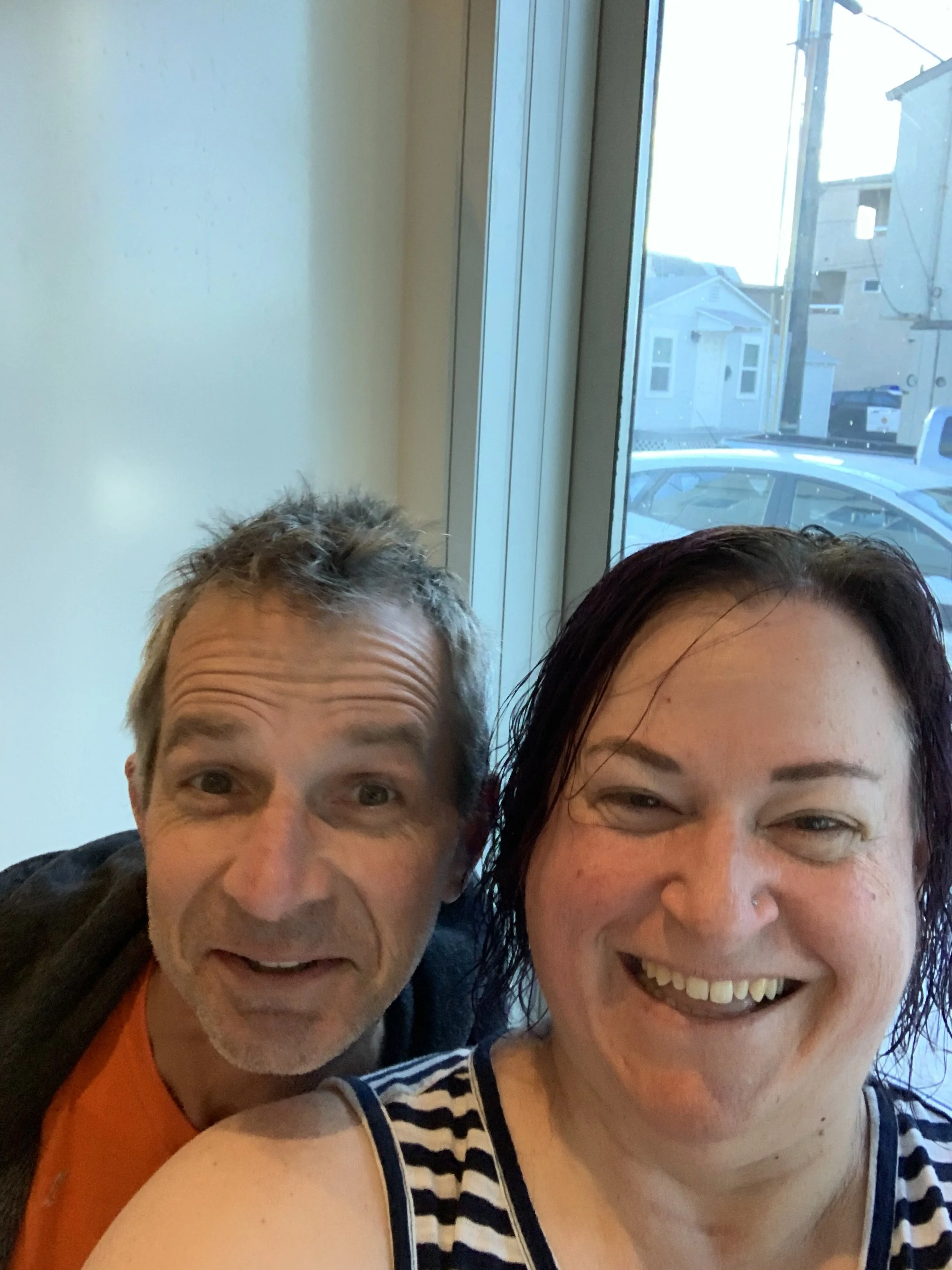 Fee and Steve smiling at the camera in a selfie