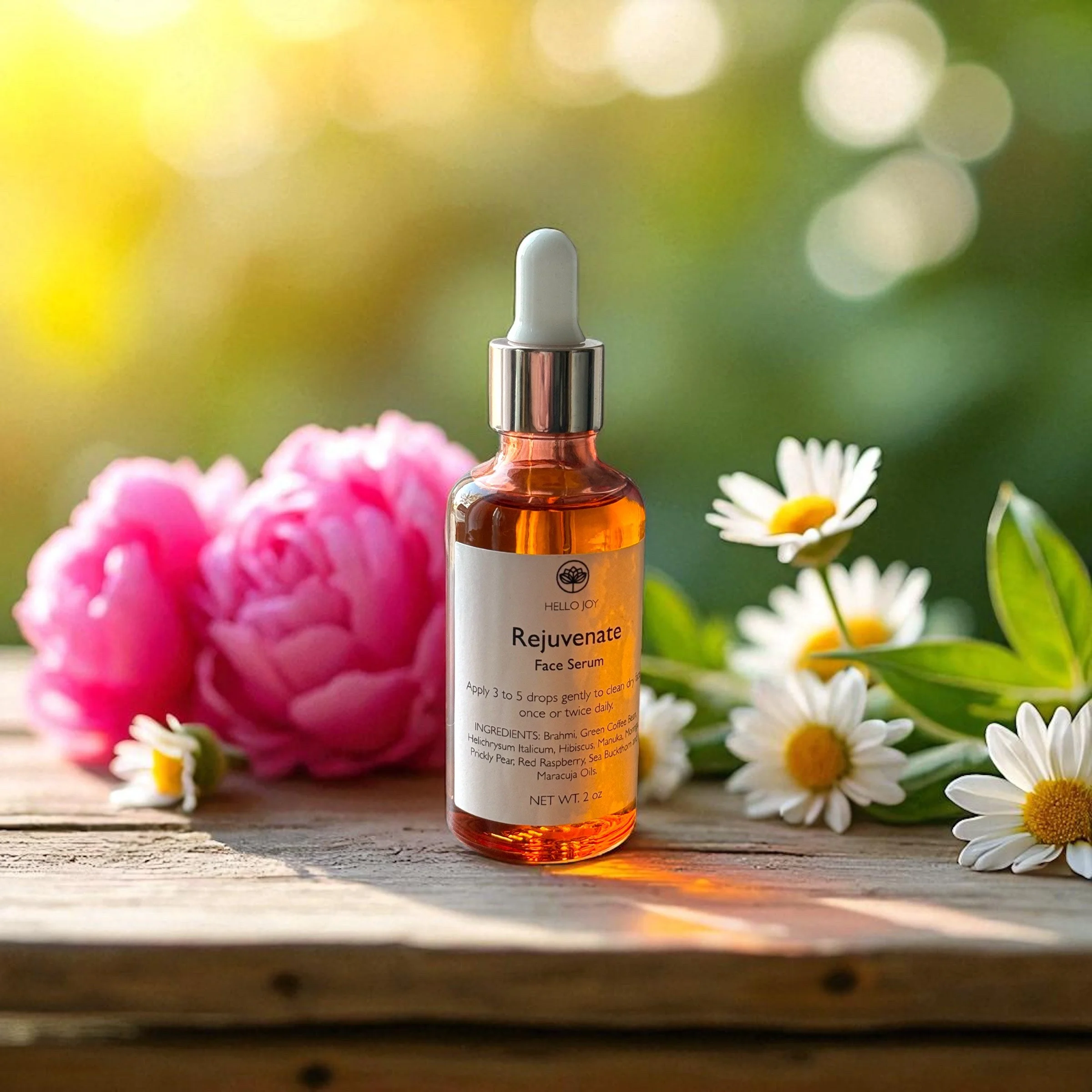 A bottle of Hello Joy Rejuvenate Face Serum with daisies and pink peony flowers on a wooden surface with a blurred green and yellow background.