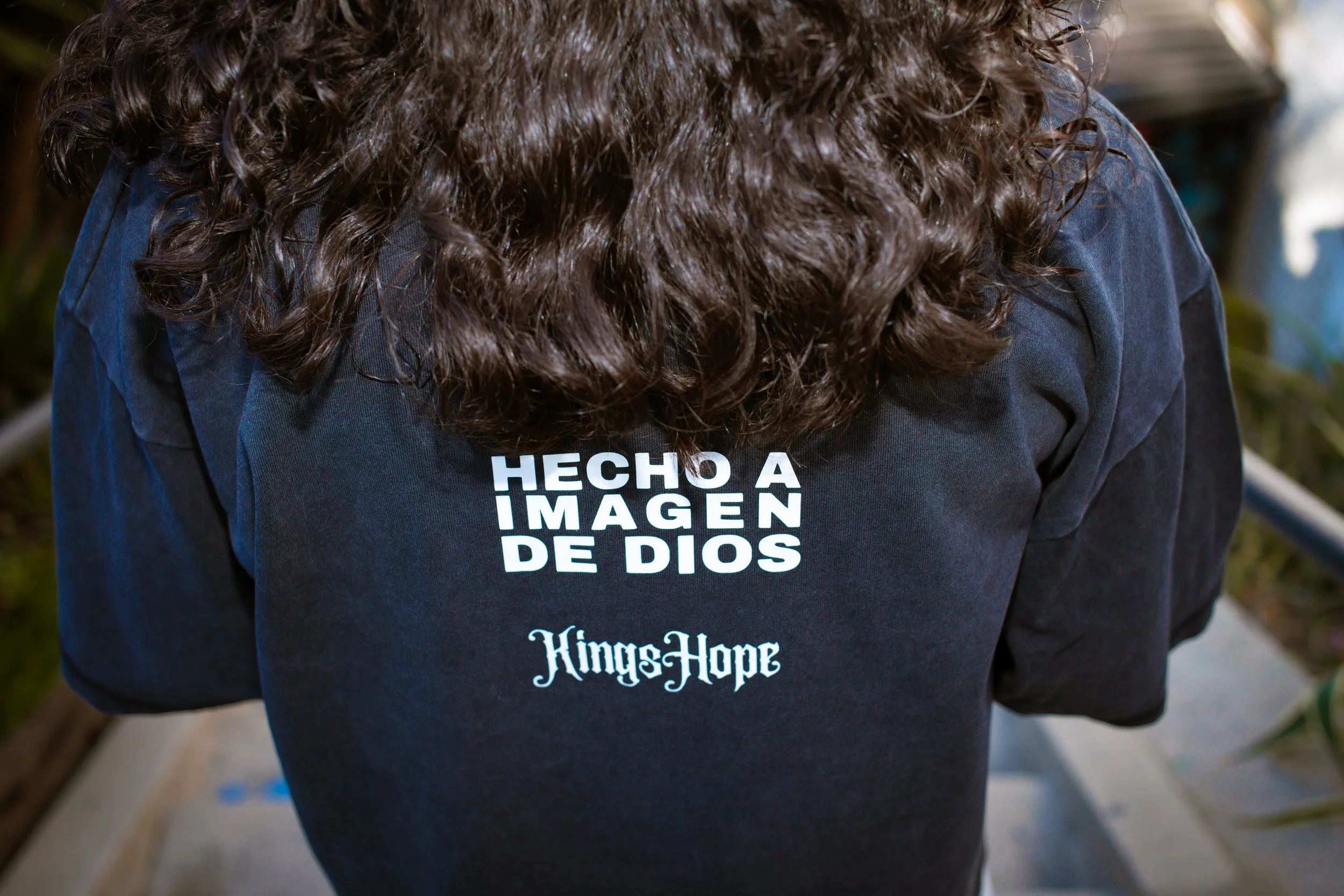 Back of KingsHope Hecho Drop Crop Tee showing Hecho A Imagen De Dios and KingsHope logo