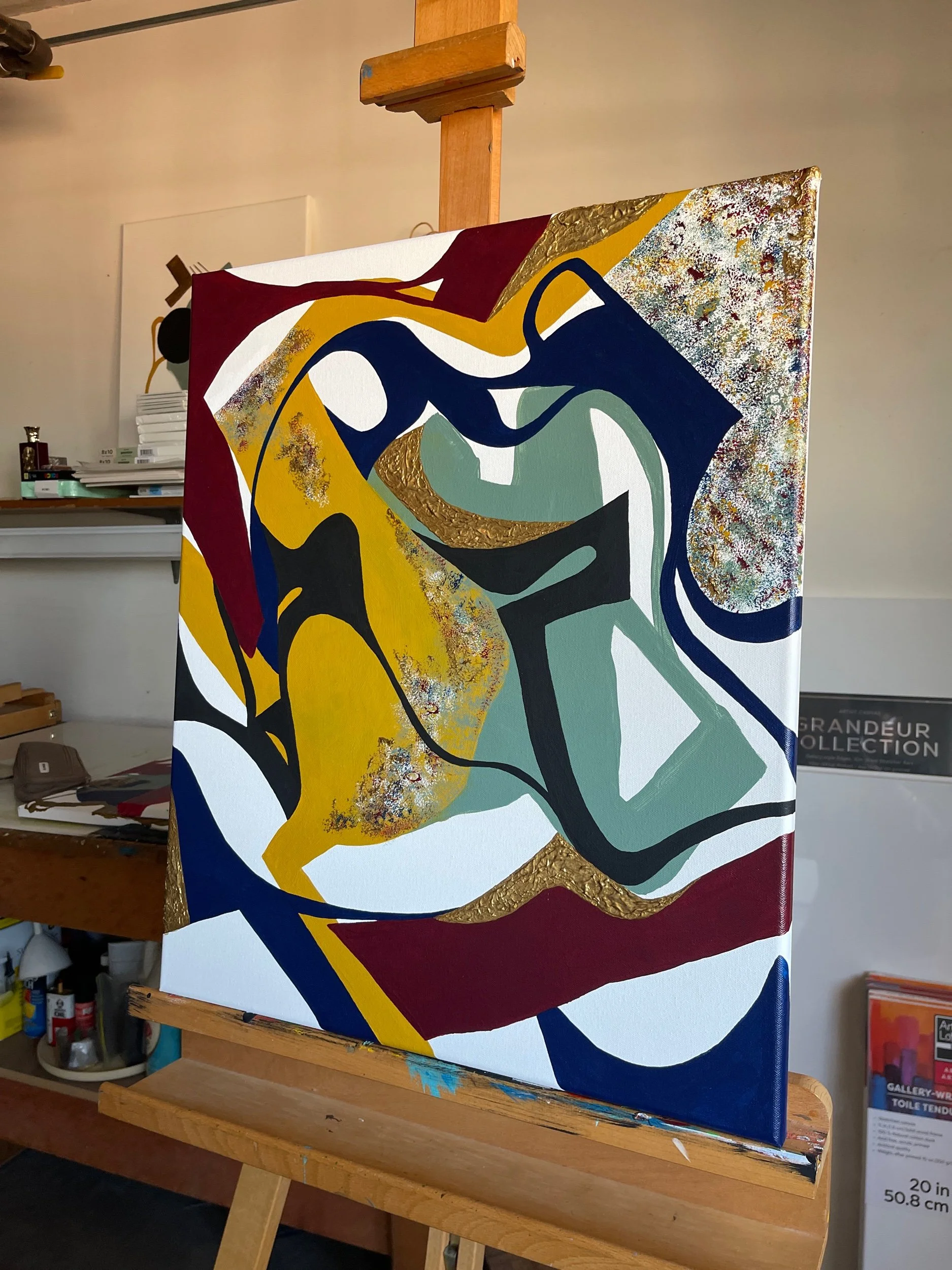 Three-quarter view of the original abstract acrylic painting Another Moment in Grief & Guilt 2 by Minnesota artist Nailah Ali displayed on an easel in the studio.