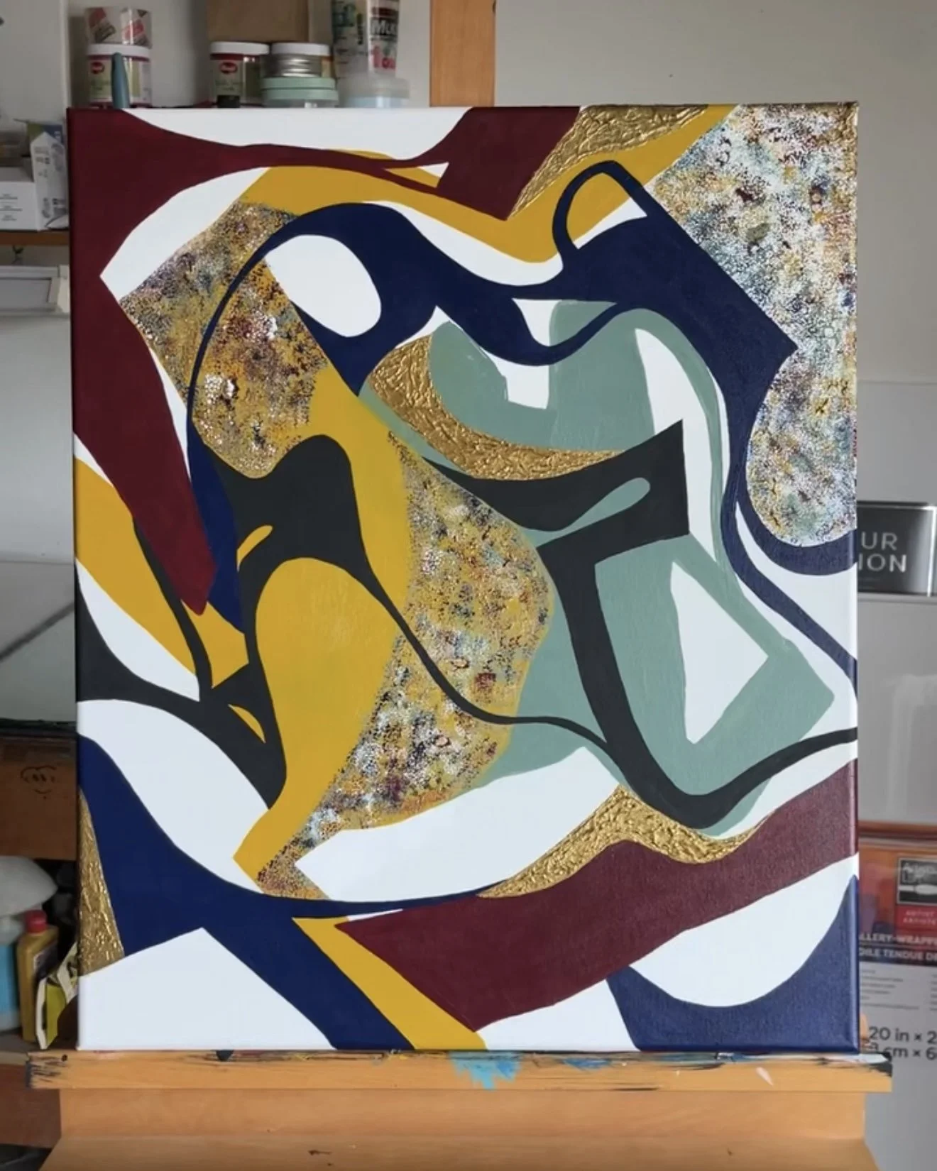 Original abstract acrylic painting titled Another Moment in Grief & Guilt II by Minnesota artist Nailah Ali featuring expressive layers of burgundy, gold, black, and soft neutral tones.