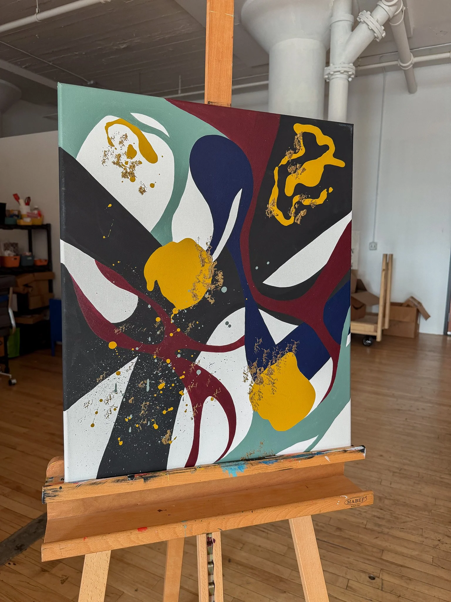 Three-quarter studio view of Another Moment in Grief & Guilt 3 displayed on an easel by Minnesota artist Nailah Ali.