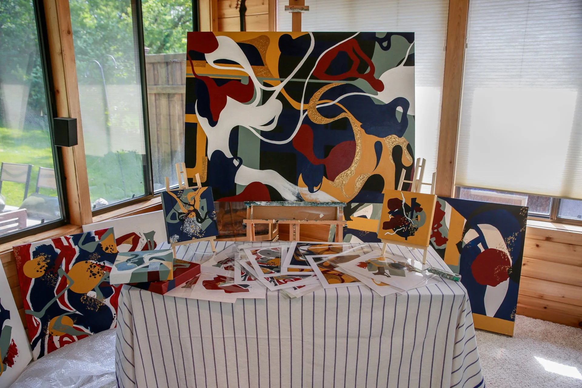 Original abstract paintings and limited edition prints from the Moments in Grief collection by Minnesota artist Nailah Ali displayed together as a complete body of work.