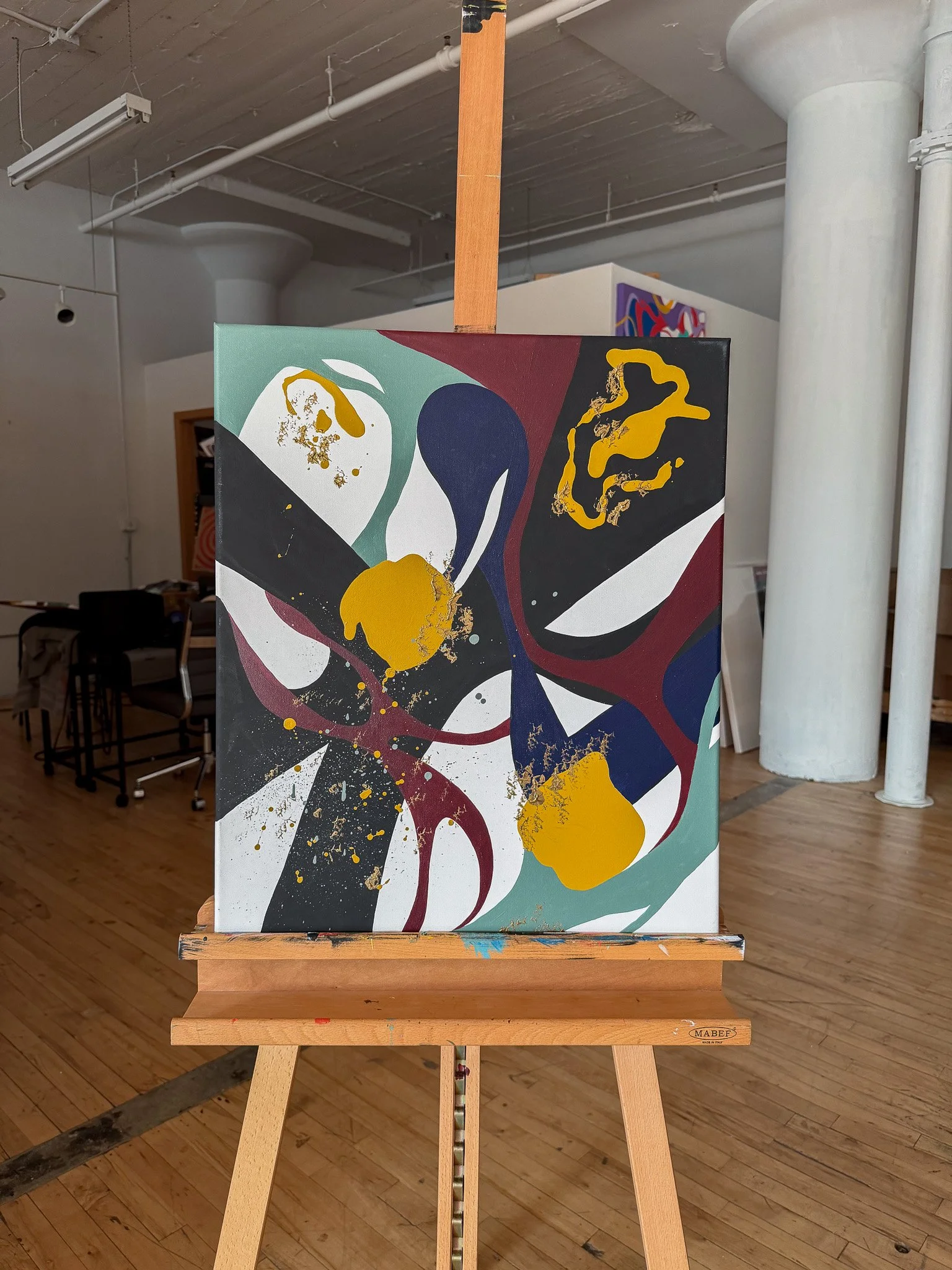 Original abstract painting Another Moment in Grief & Guilt 3 displayed on an easel in the studio by Minnesota artist Nailah Ali.