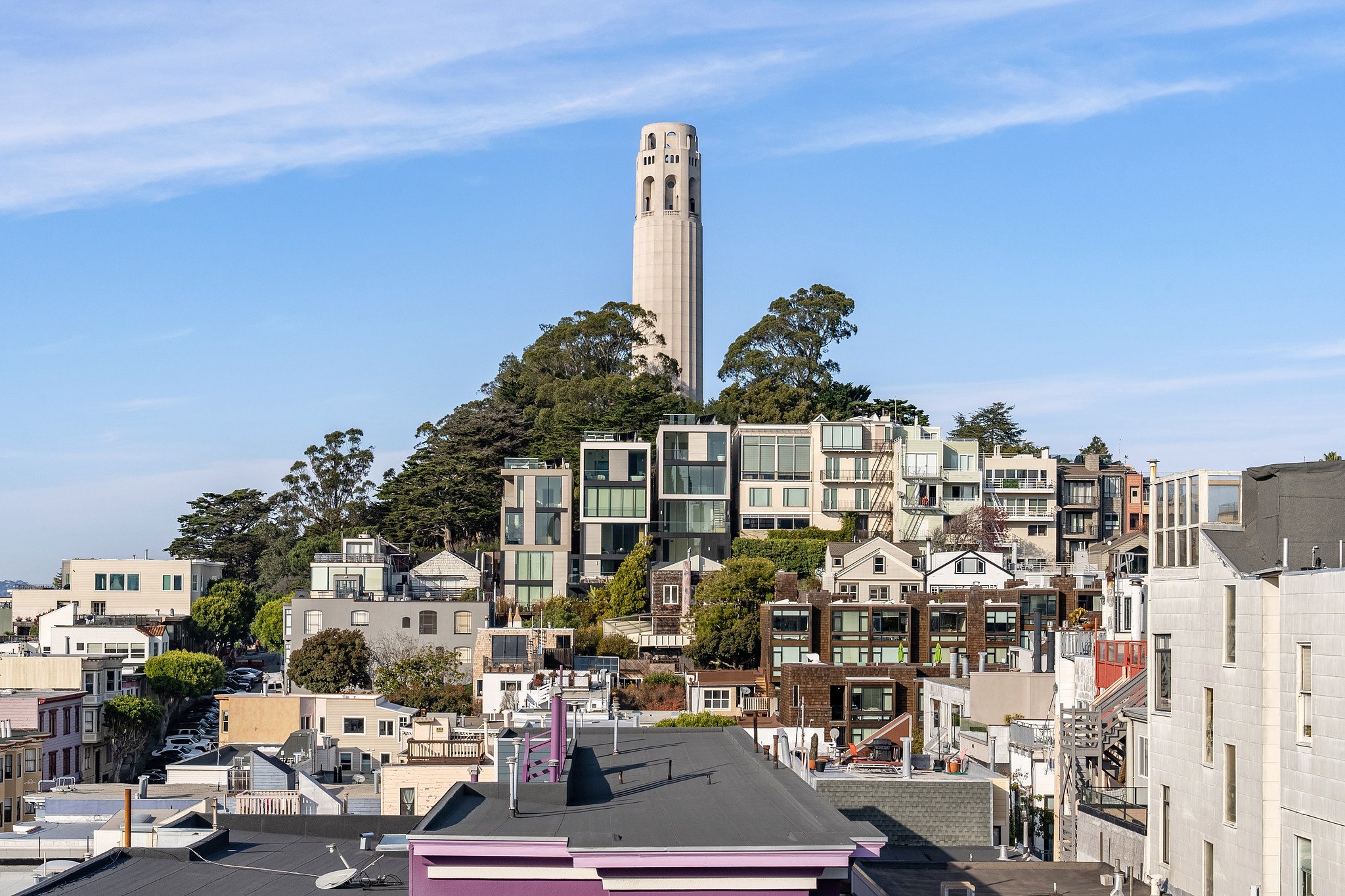 A landscape view of contemporary houses below Coit Tower, San Francisco.