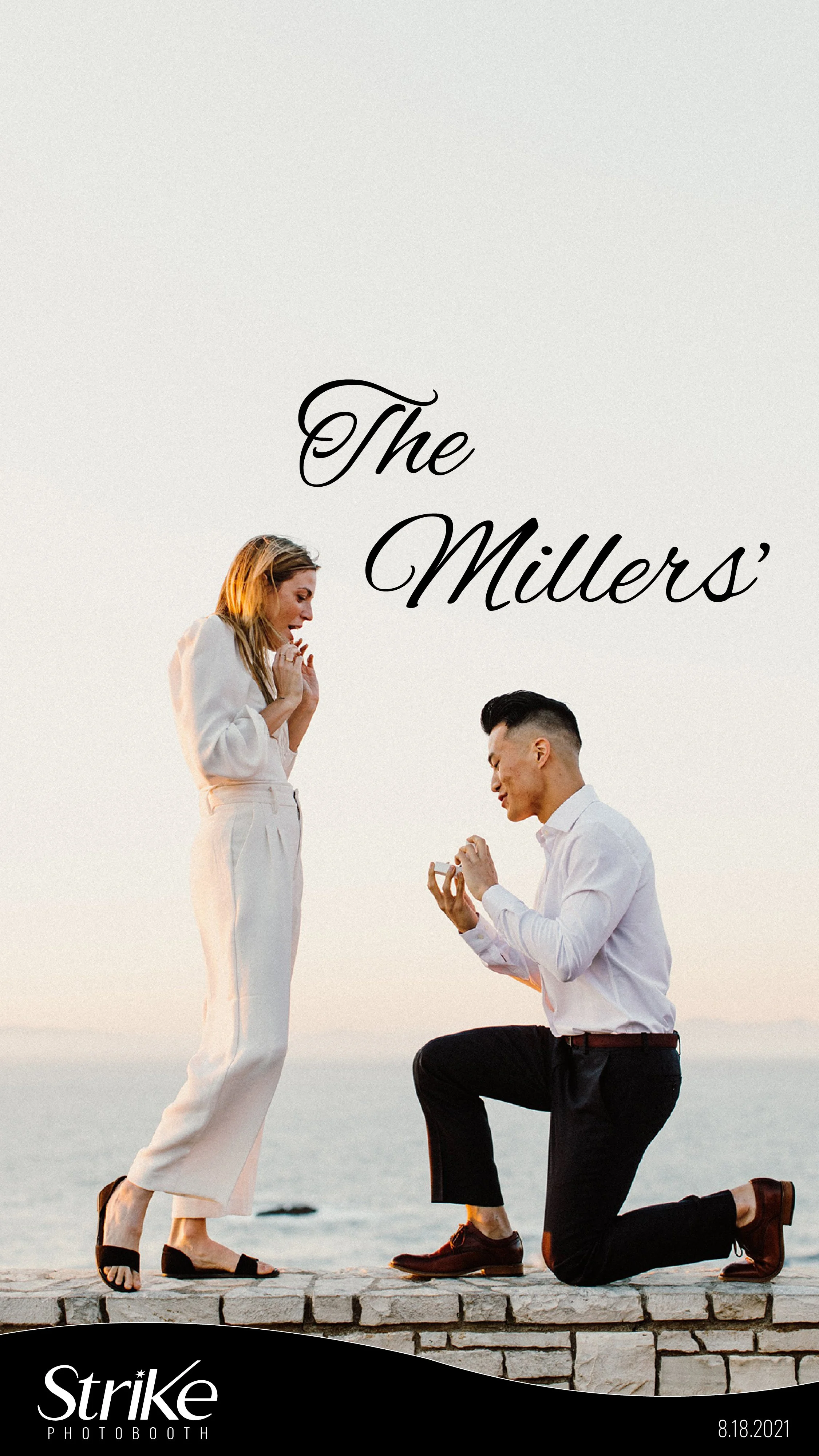 A man kneeling in front of a woman proposing on a stone ledge by the water at sunset.