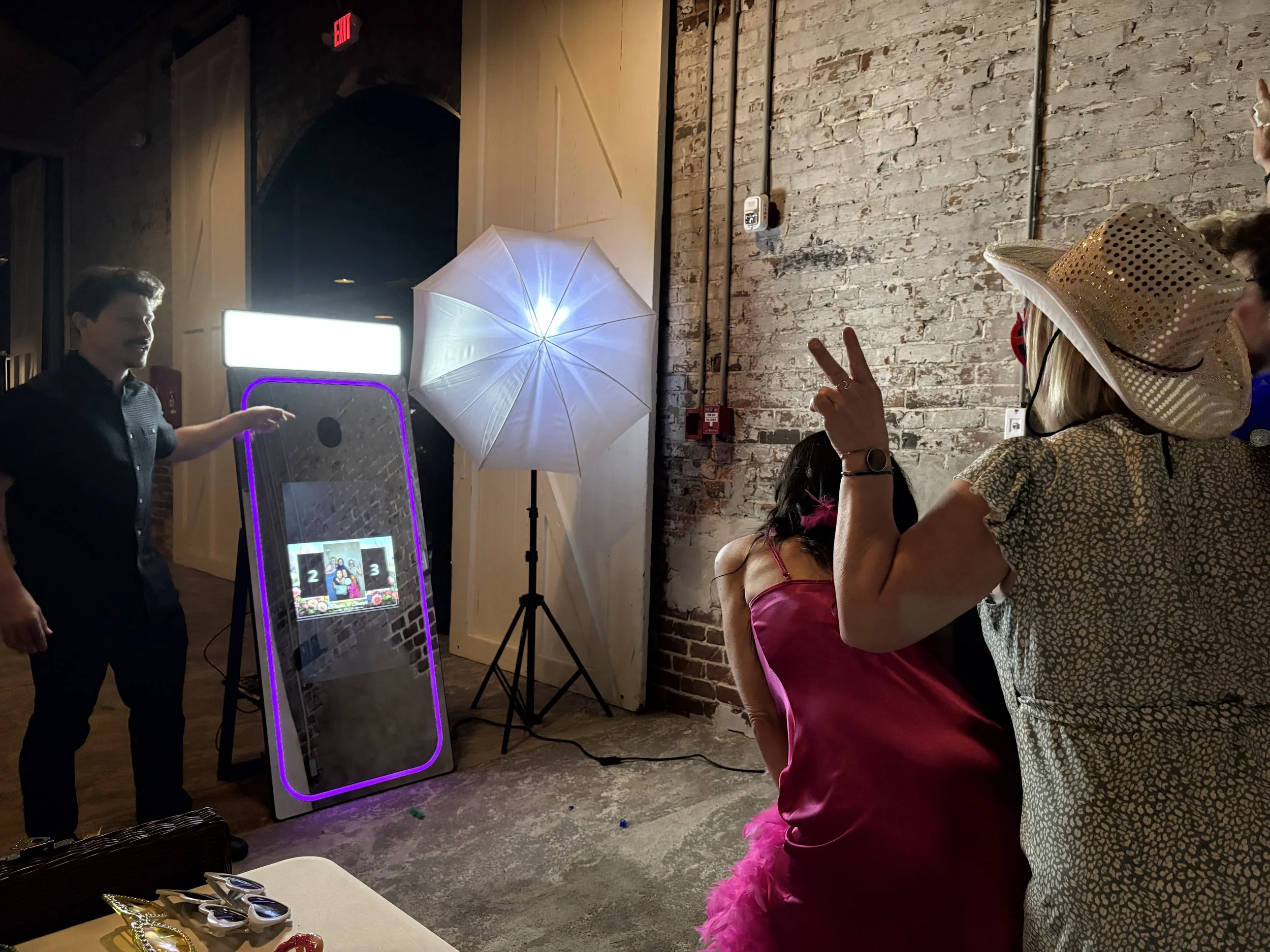 Professional attendant, telling guests where to look and smile for the camera, in wilmington NC at the a loft convention center