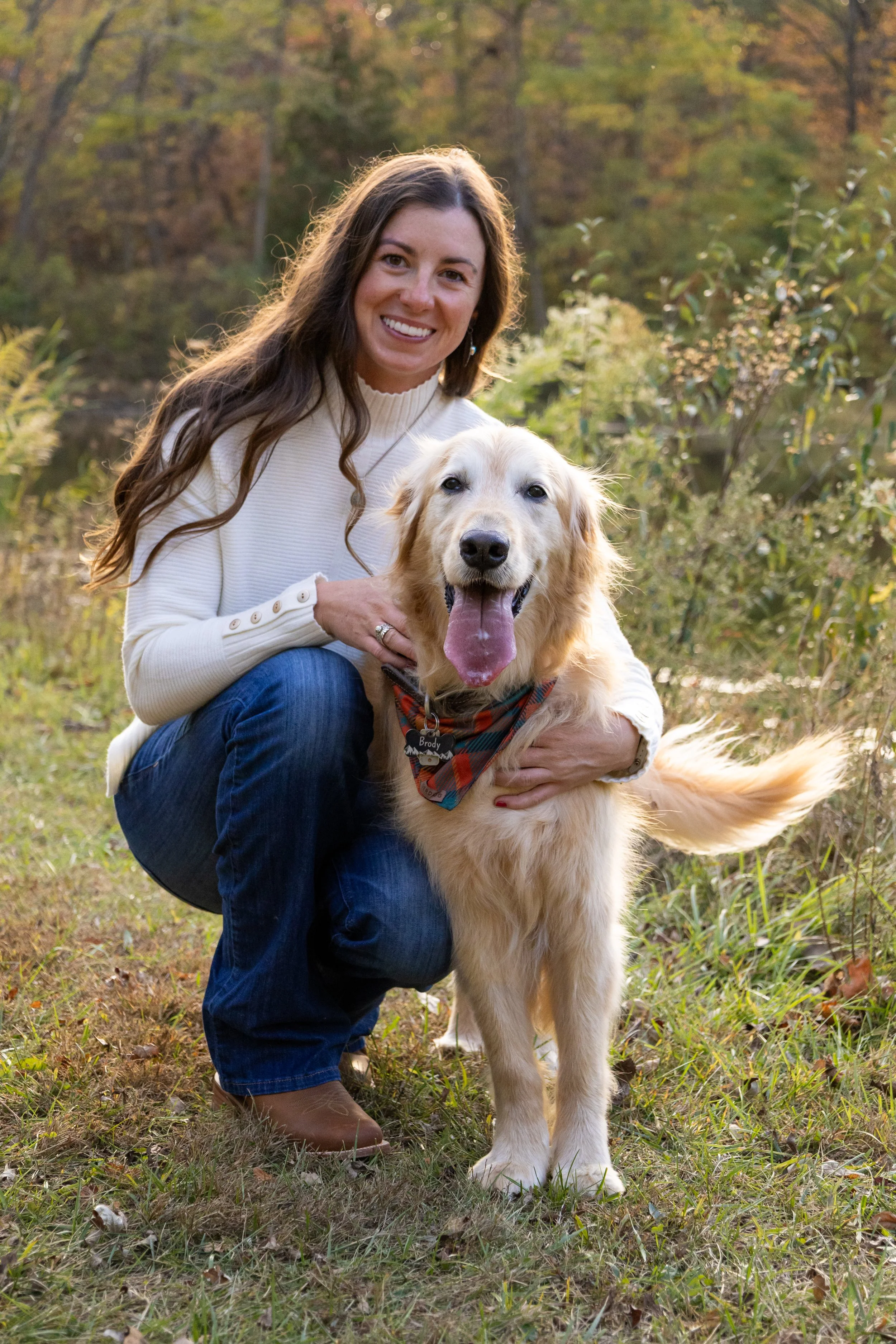 dog and mom together in the sunshine at a park near homestead in fort wayne