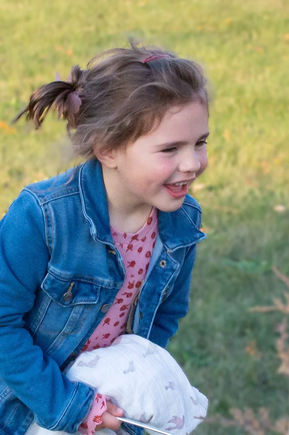 Photograph of a girl laughing and playing in Huntington county Indiana