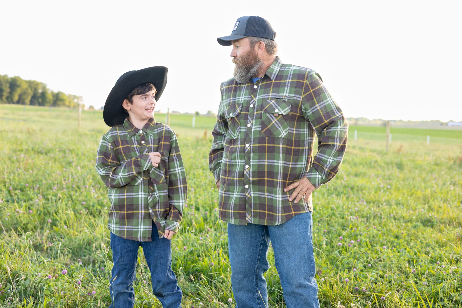 Dad and son having a good candid time in a farm field country setting in North Manchester, Indiana
