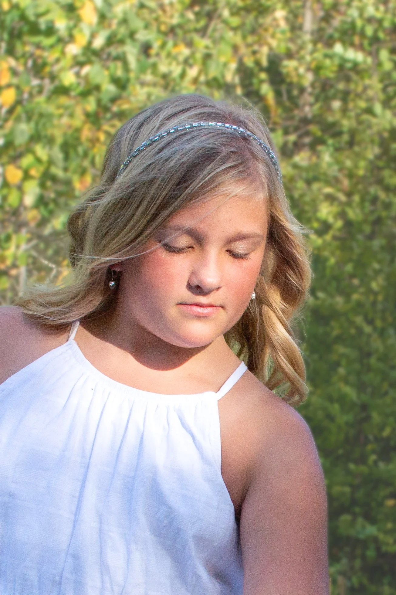 Girl in the sunshine being photographed in Huntington Indiana at Buckner Park
