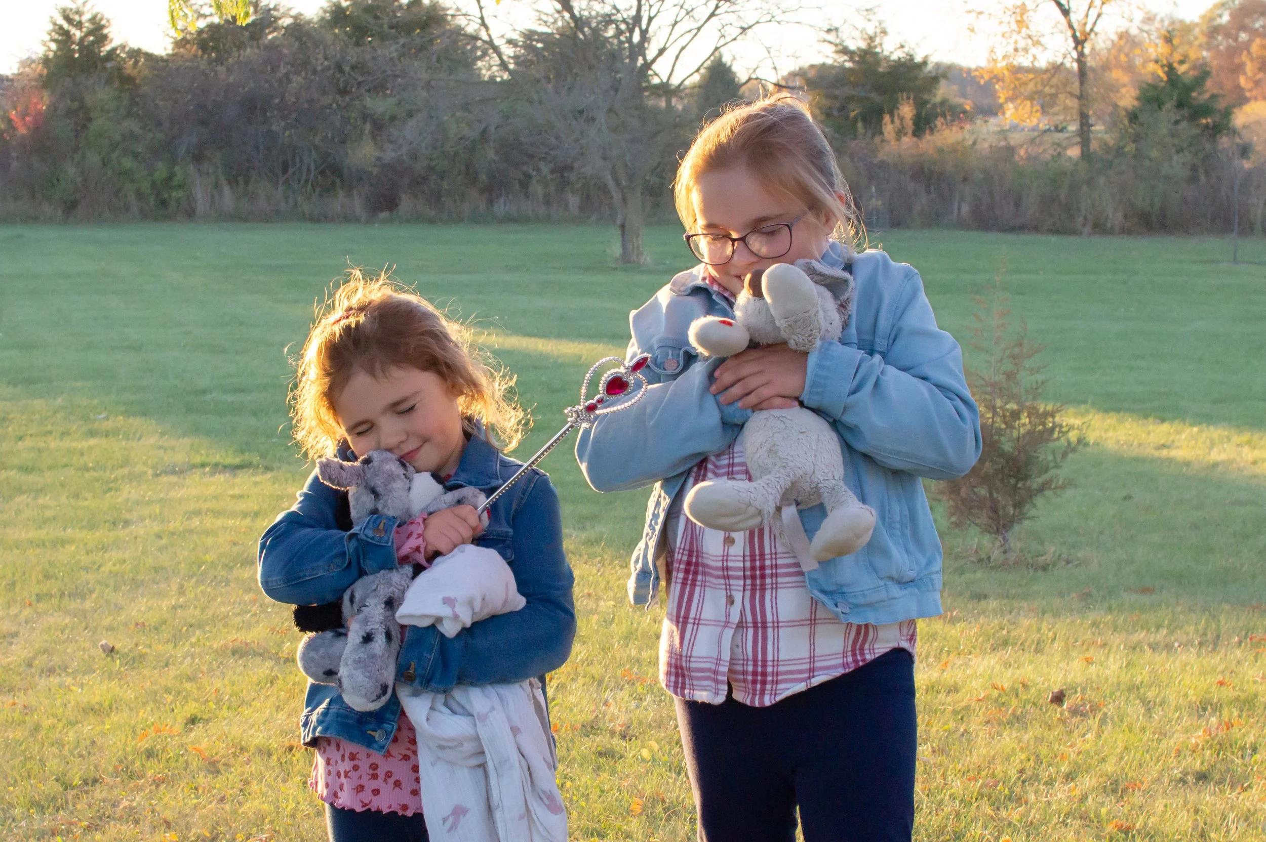 Sisters photographed hugging animals in Huntington Indiana