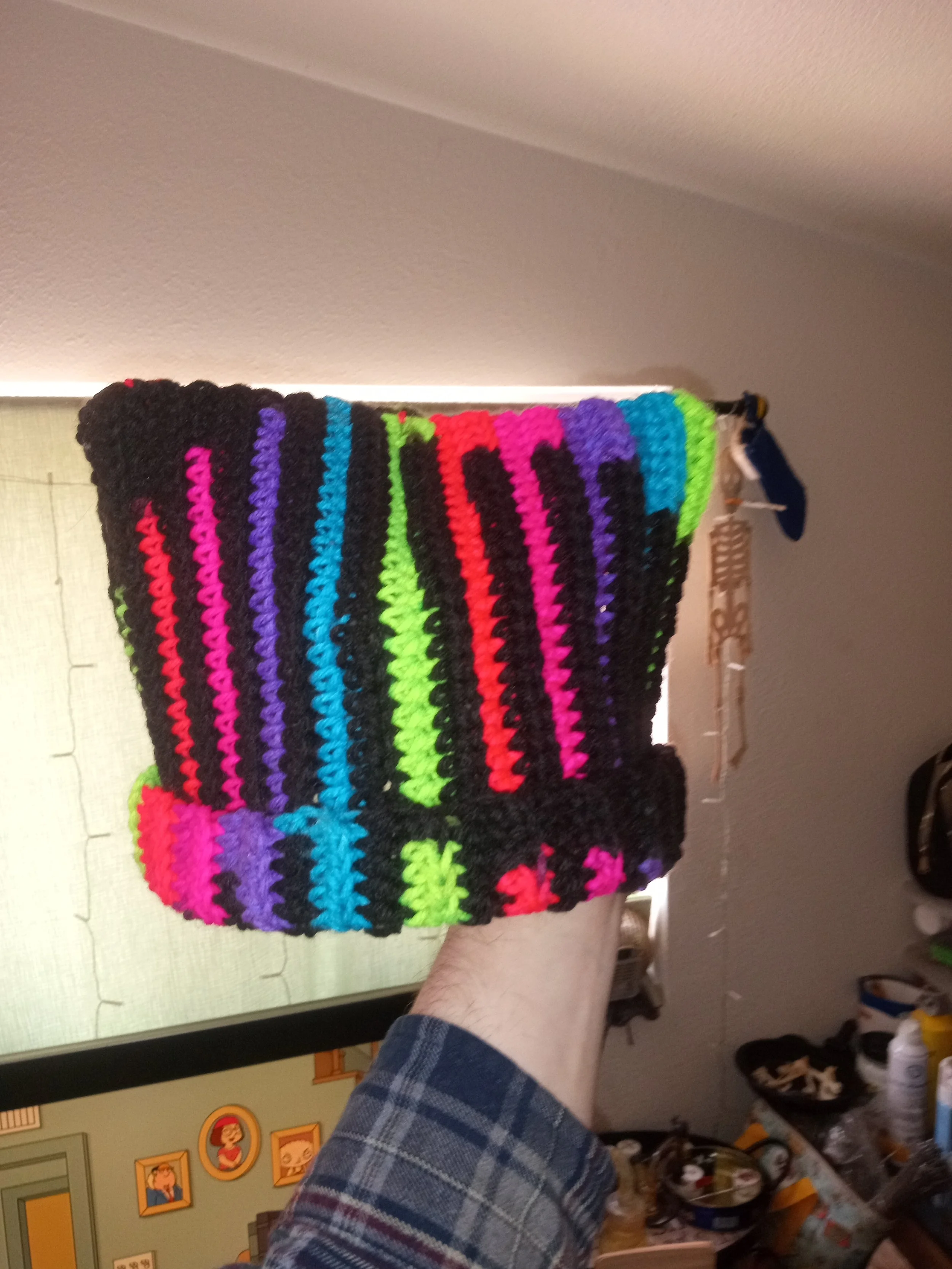Colorful, striped crocheted blanket with bright colors including black, pink, purple, blue, green, and red. Artisan, Handmade, Grass valley, nevada county, Kale Burnett, Crocheted Beanie, art.