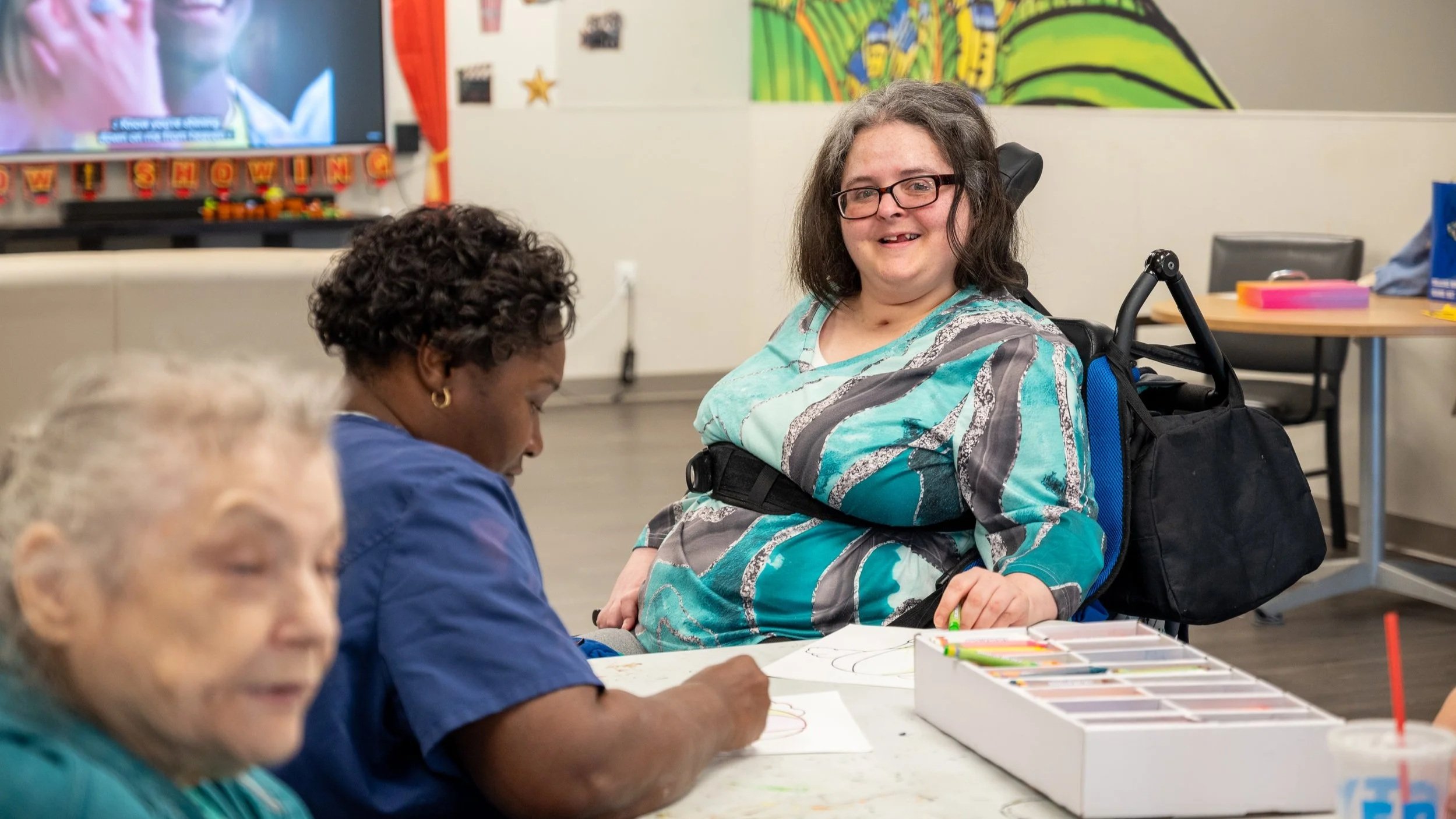 ECNWO adult day services participants engaged in group activity supporting social connection and skill development in Northwest Ohio