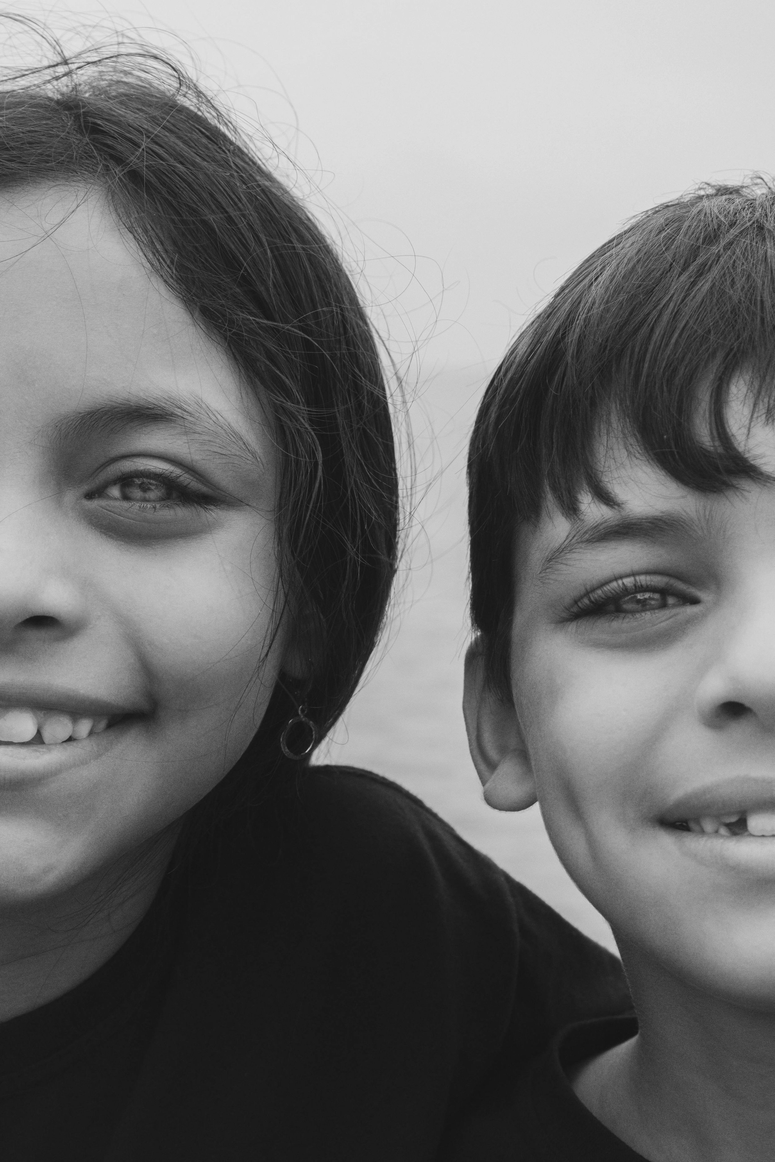 brother and sister smiling
