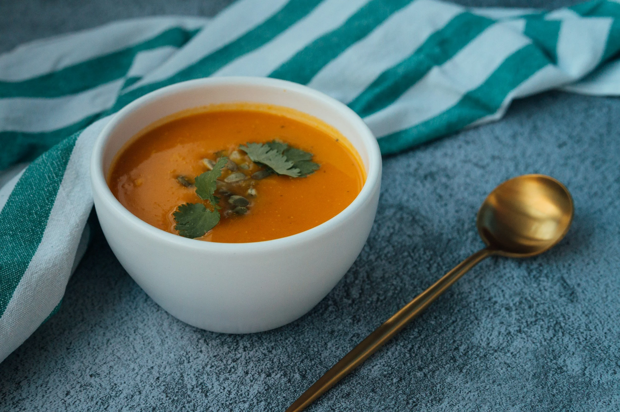 Bowl of soup and spoon on a table