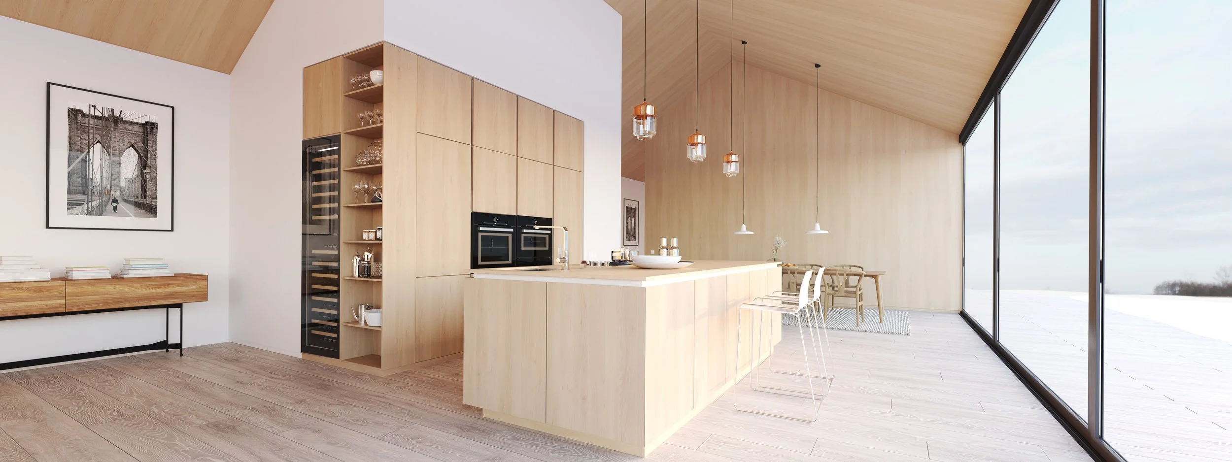 Cuisine moderne avec îlot en bois clair, grandes fenêtres offrant vue sur l'extérieur, décoration minimaliste, œuvres d'art suspendues et mobilier simple.