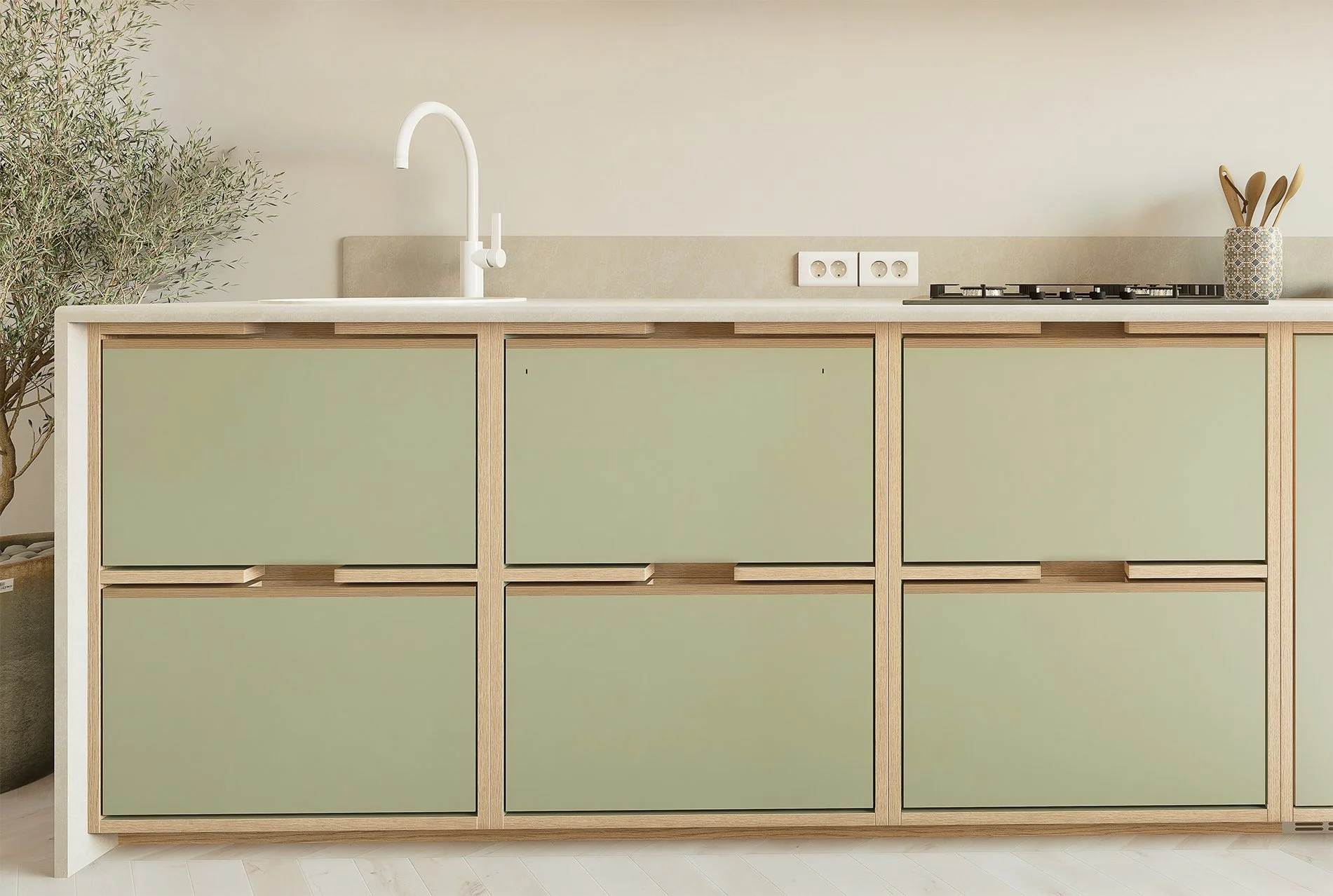 Cuisine moderne avec un plan de travail en blanc, un évier avec robinet blanc, des prises électriques et une cuisinière à gaz, décorée avec un pot à ustensiles, un arbre en pot et un mur beige.