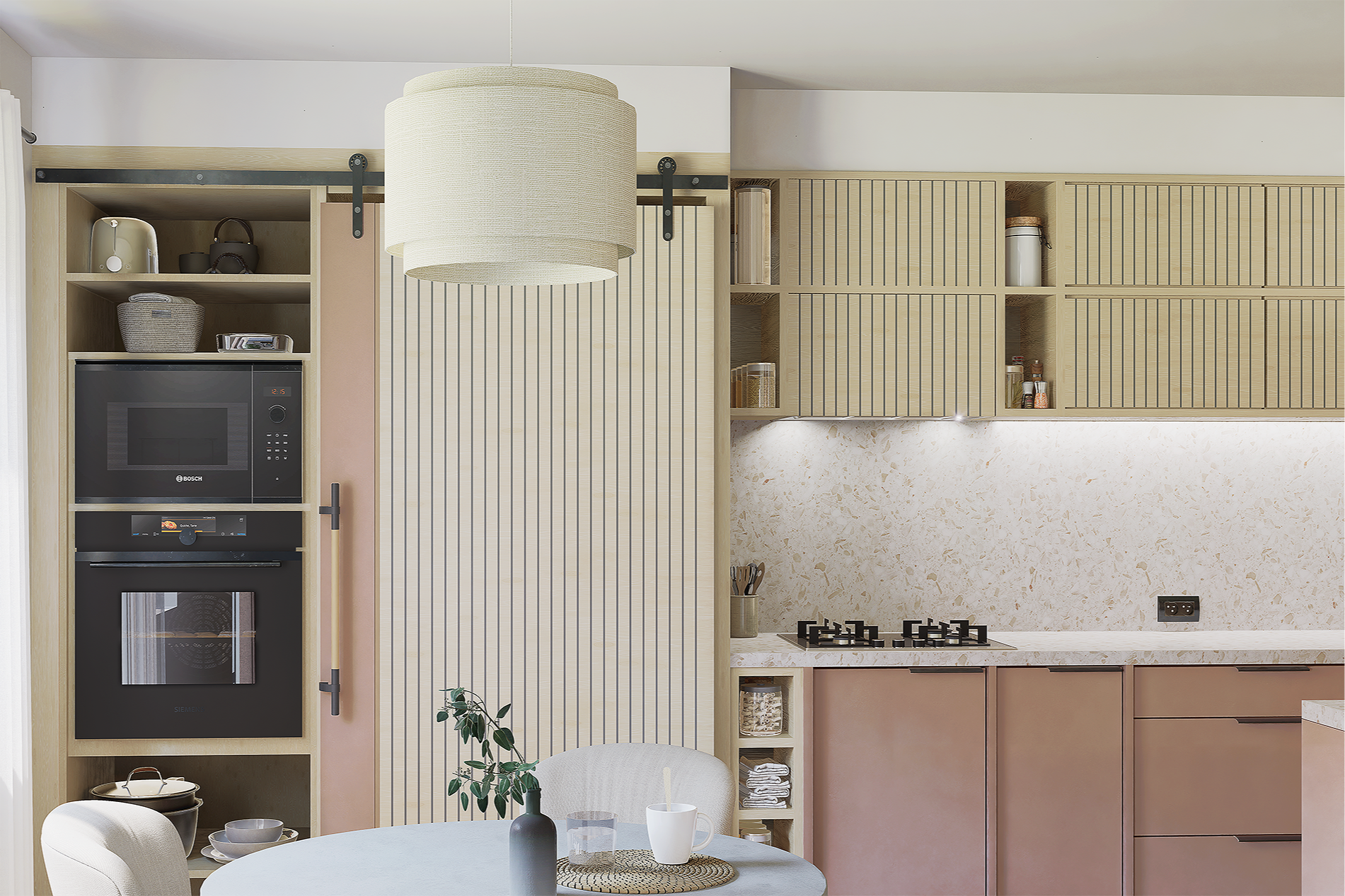 Cuisine moderne avec peinture beige, cuisine intégrée, réfrigérateur, four, micro-ondes, table ronde avec vaisselle, plantes vertes et luminaire suspendu.