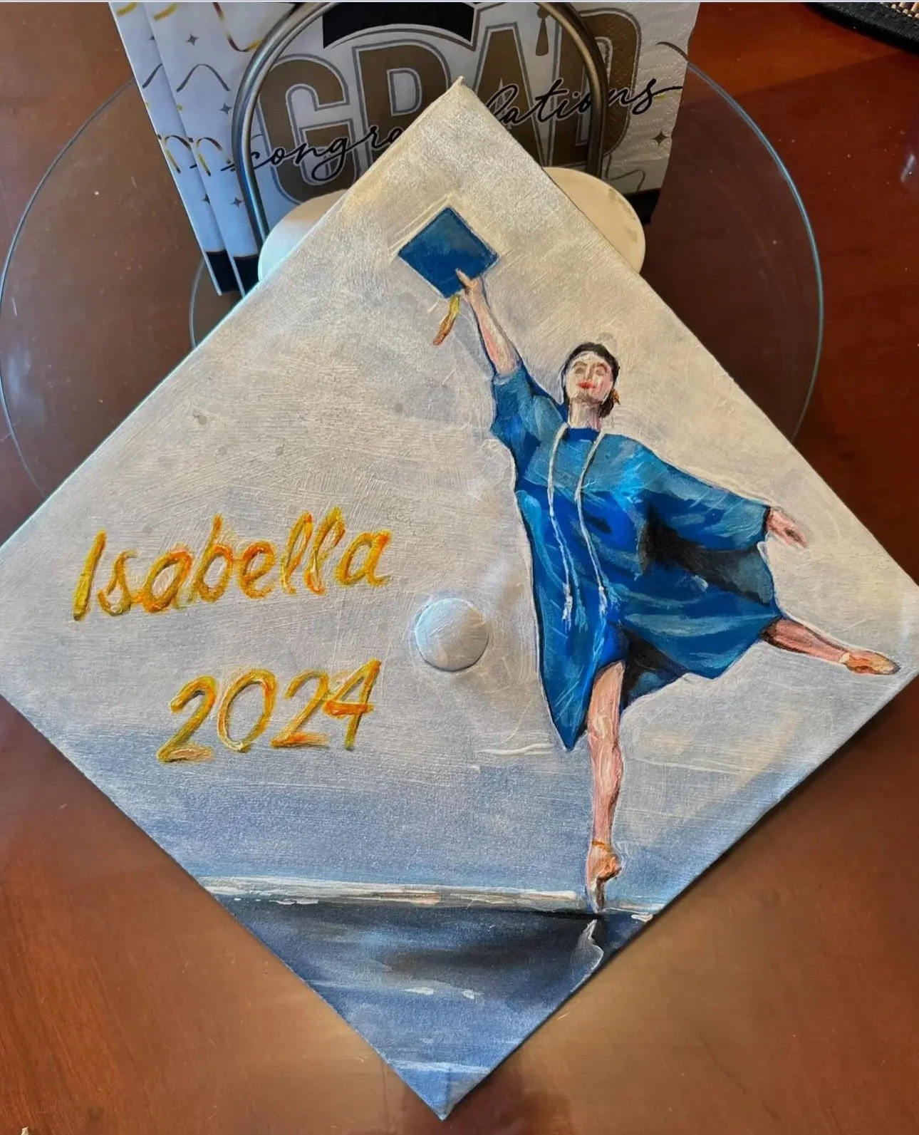 Custom painted graduation cap for a dancer by Colin Breslin