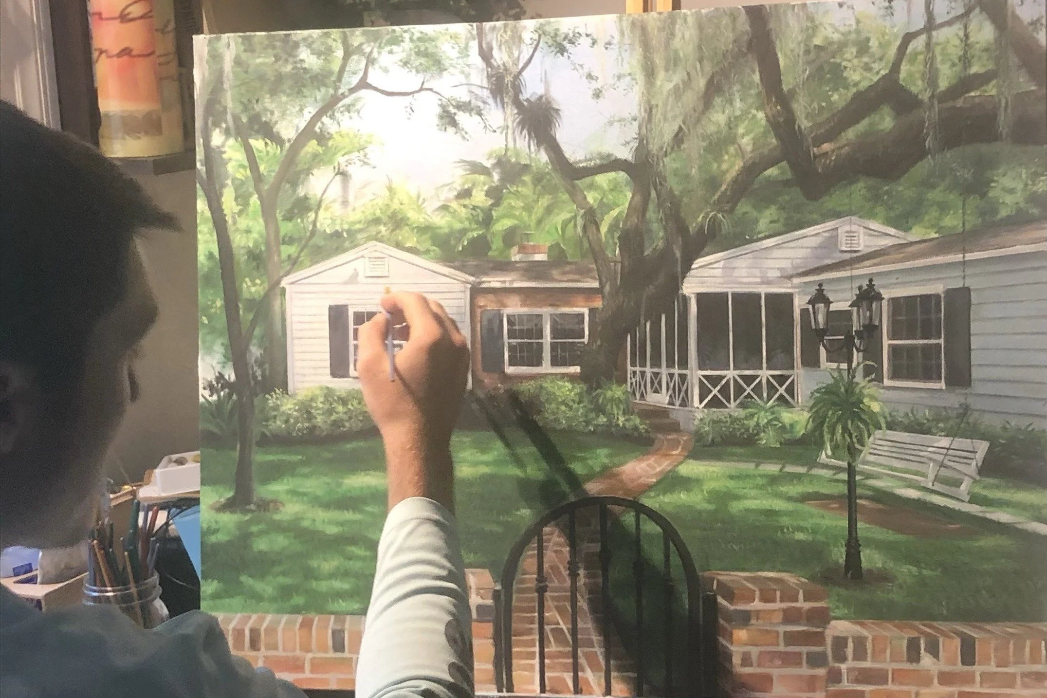 Colin Breslin painting the commissioned house portrait in his studio