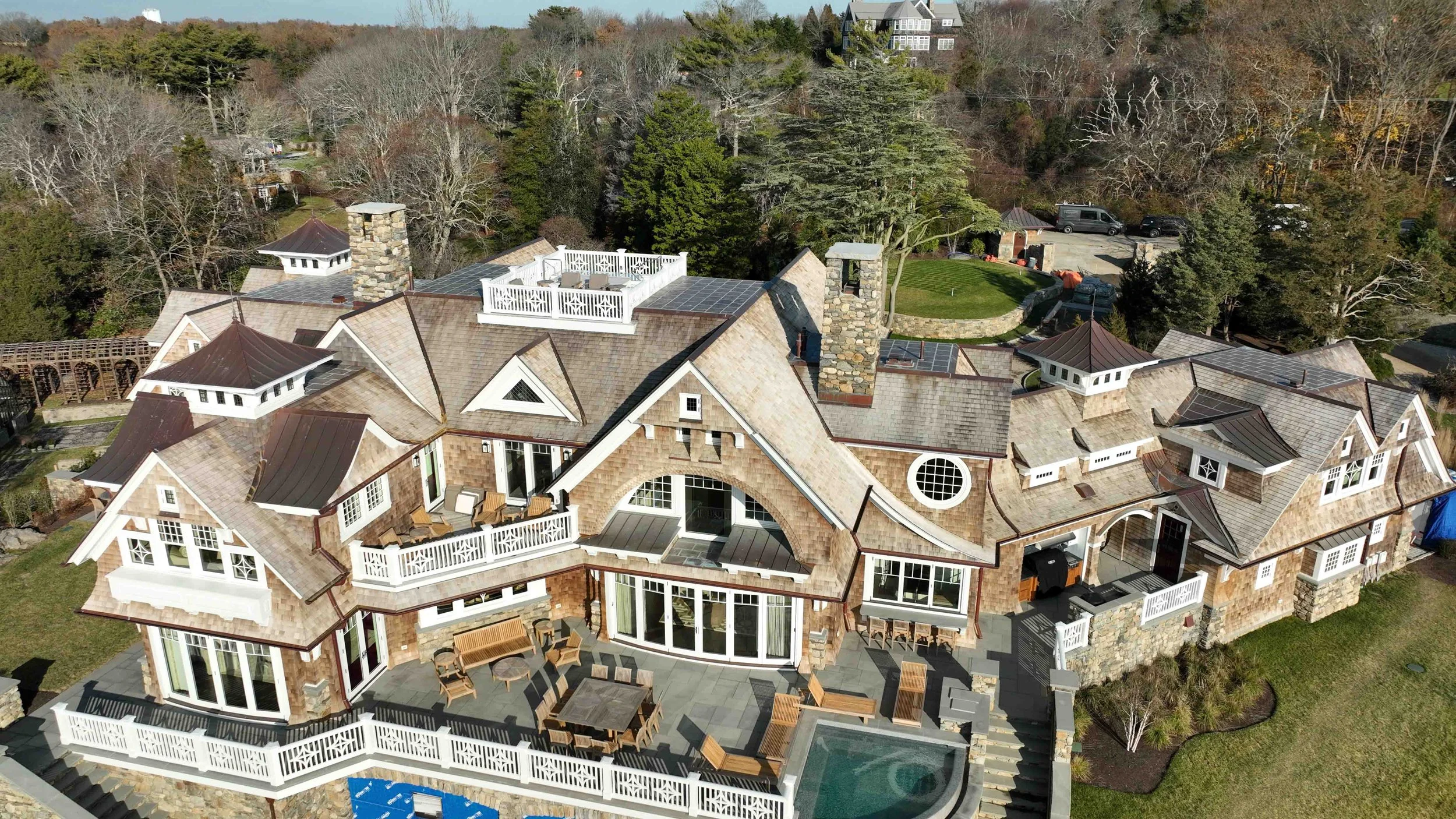 Wood roofing project, Mackerel Cove, featuring western red cedar with copper standing seam, copper flashing, gutters, and finials in Jamestown, Rhode Island.