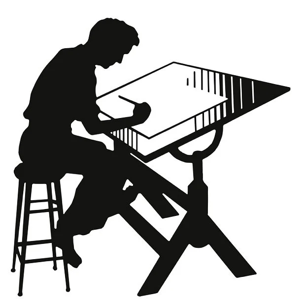 Silhouette of a person sitting on a stool and using a hammer on a metal table with a tilted surface.